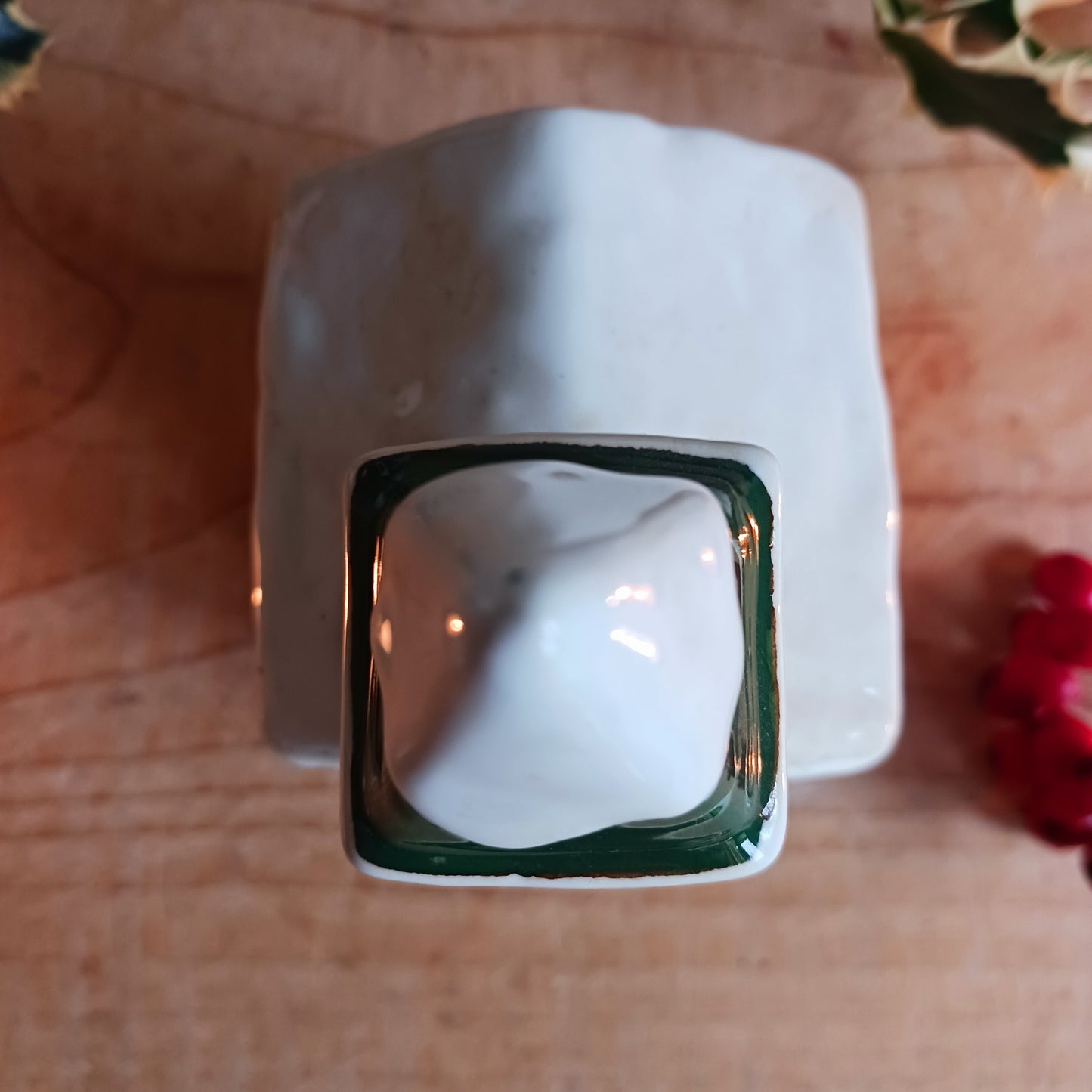 Handcrafted in the Village Pottery workshop, this charming Little Christmas Church Ceramic Tealight Holder brings traditional festive magic into your home. Made from high-quality ceramic with intricate detailing, it captures the timeless beauty of a snow-covered village church.