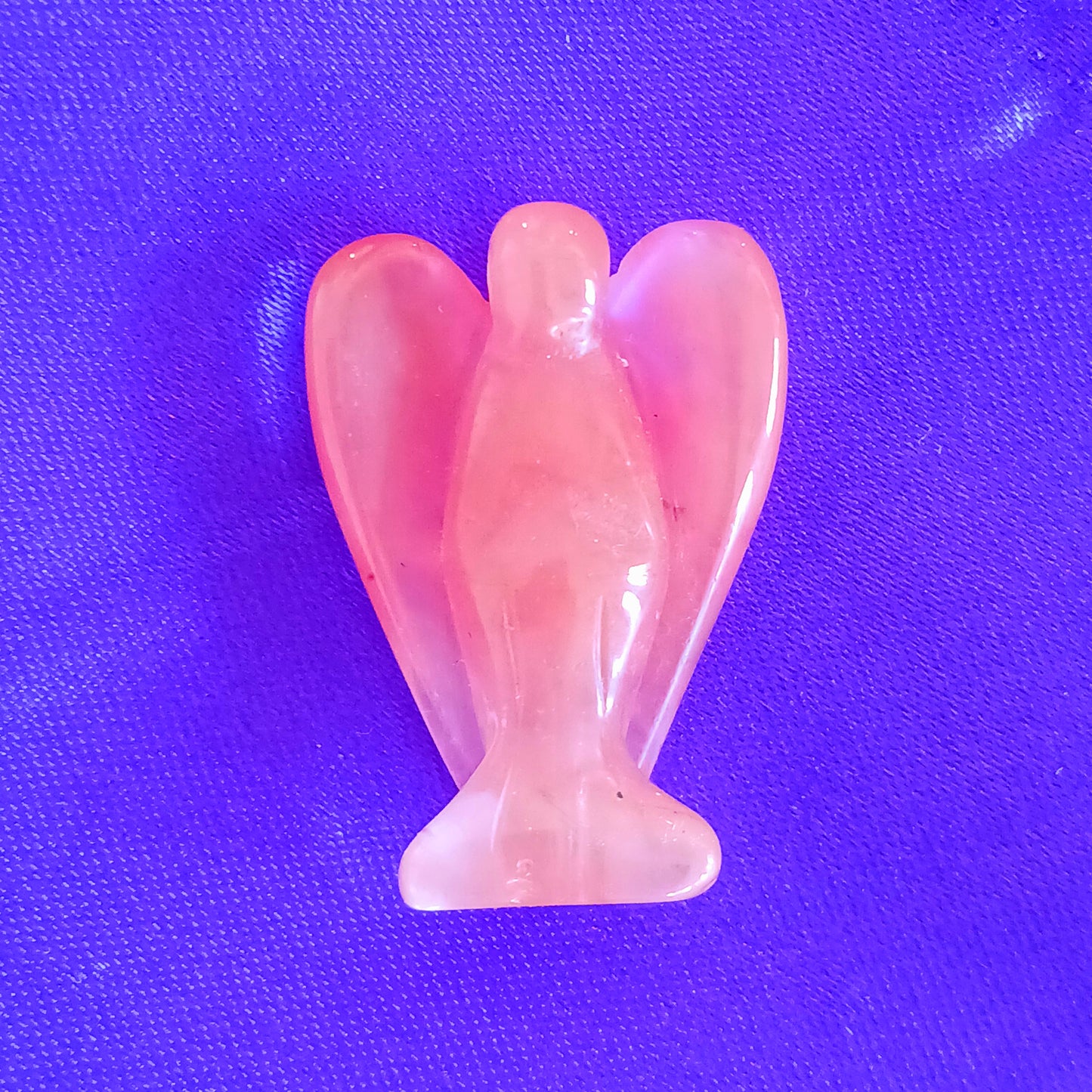 These little hand carved cherry quartz crystal pocket angels are lovely as gifts. Each crystal angel is unique. They are designed to be held, placed in little corners or can be kept in your pocket.