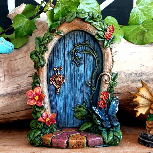 Bring a touch of magic to your home or garden with this beautifully crafted blue fairy door, designed to spark imagination and enchant any space.
