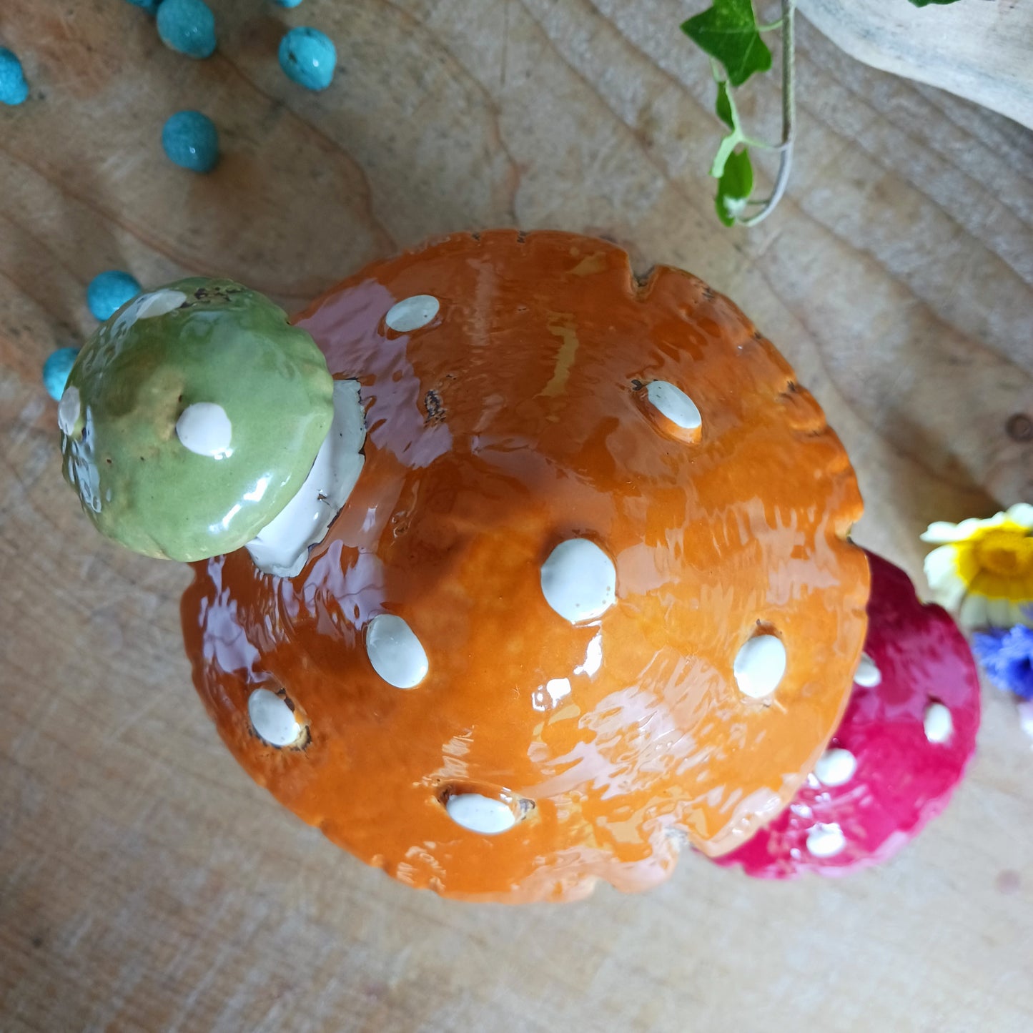 Bring a touch of magic and warmth to your home or garden with this Village Pottery Mushroom House Tealight Holder. Handcrafted with care, this charming ceramic tealight holder features two quaint mushroom houses that cast a soft, enchanting glow - perfect for creating a cozy atmosphere in any space.