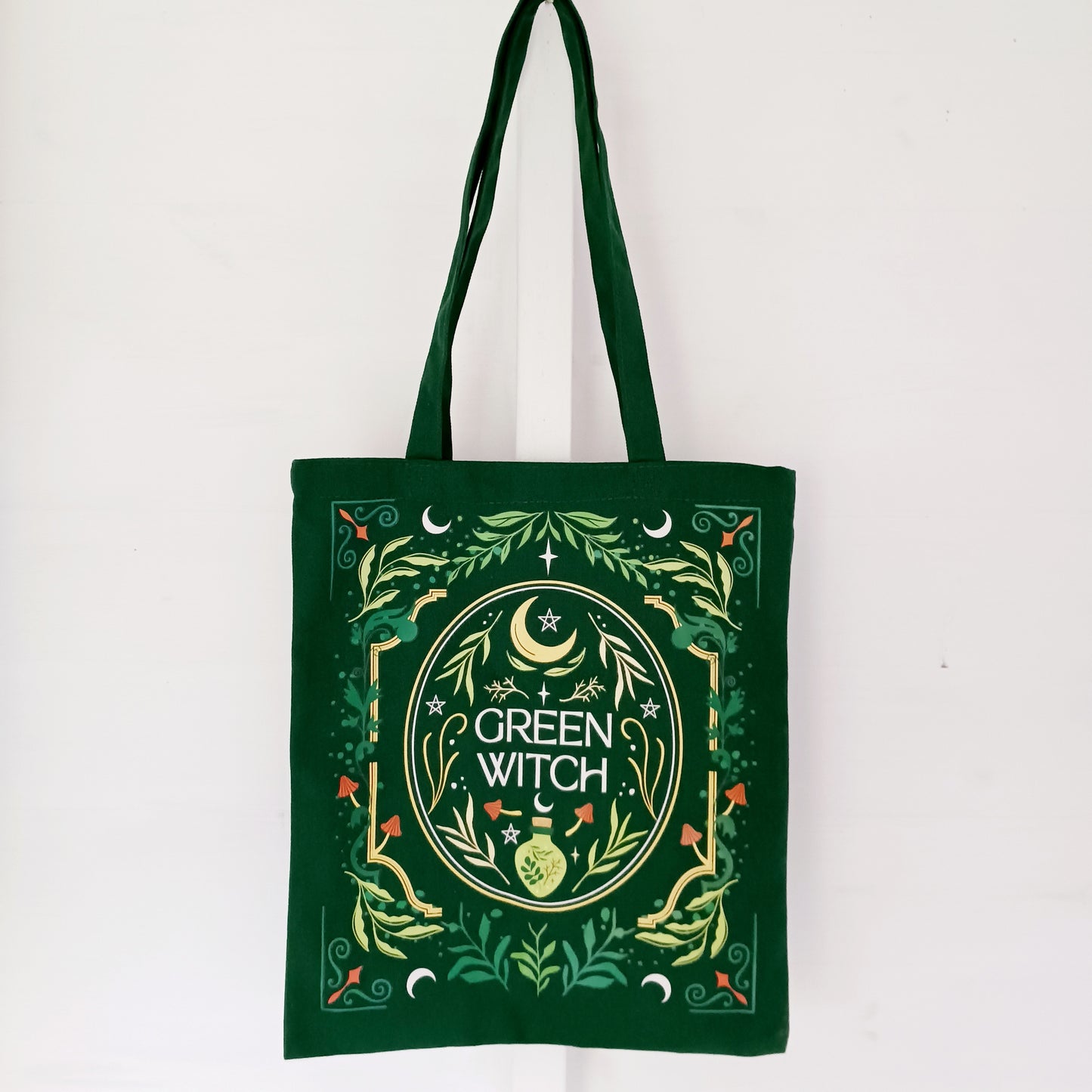 The Green Witch Tote Bag is a practical and stylish companion for carrying freshly picked herbs, spell books, or everyday essentials.