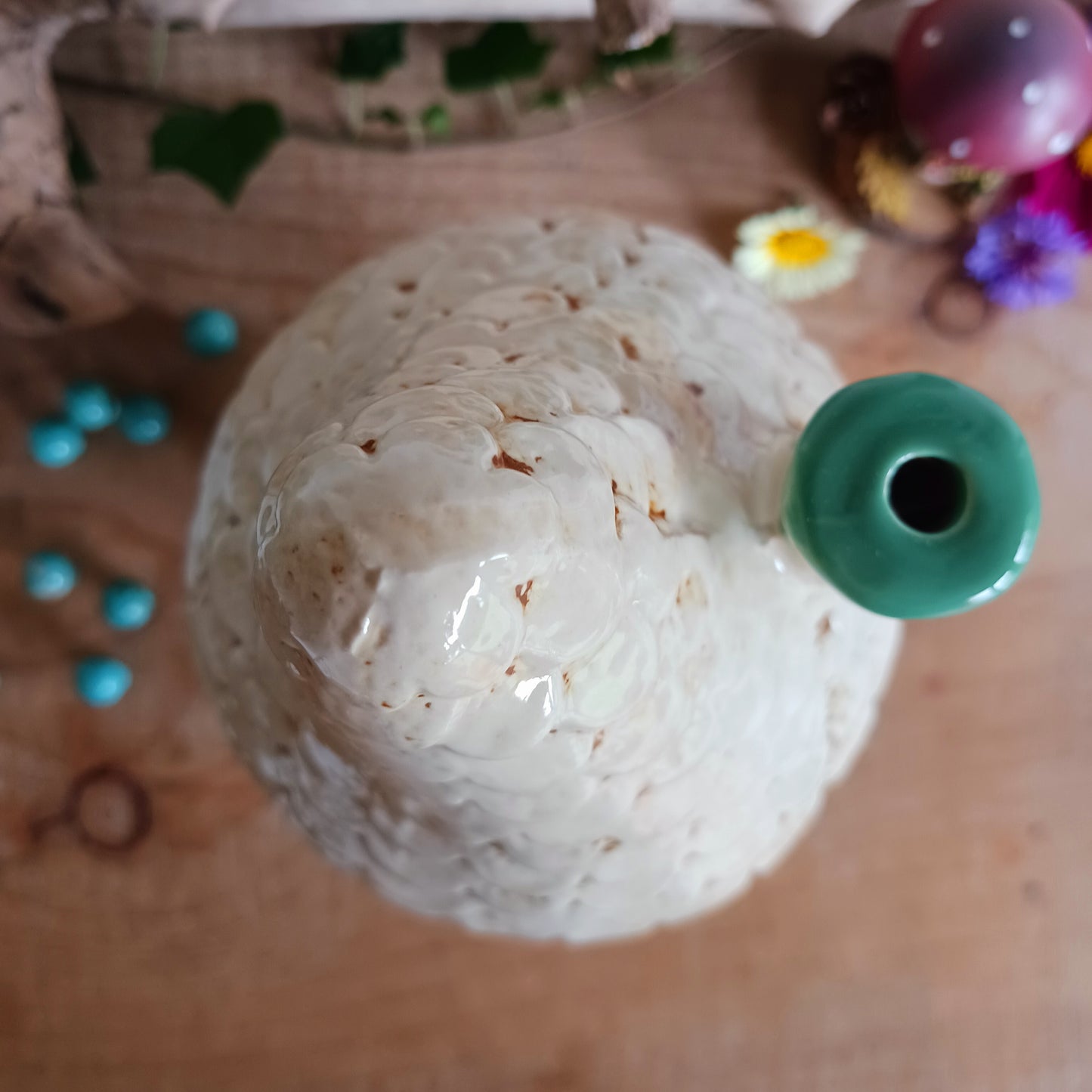 Add warmth and charm to your space with this teal round tealight house. Crafted from quality ceramic, this decorative piece makes a perfect gift or a cozy addition to your own home. Display it as a stand-alone ornament or pop in a tealight to create a soft, inviting glow. For a magical touch, collect the full range and build your own enchanting village of light.