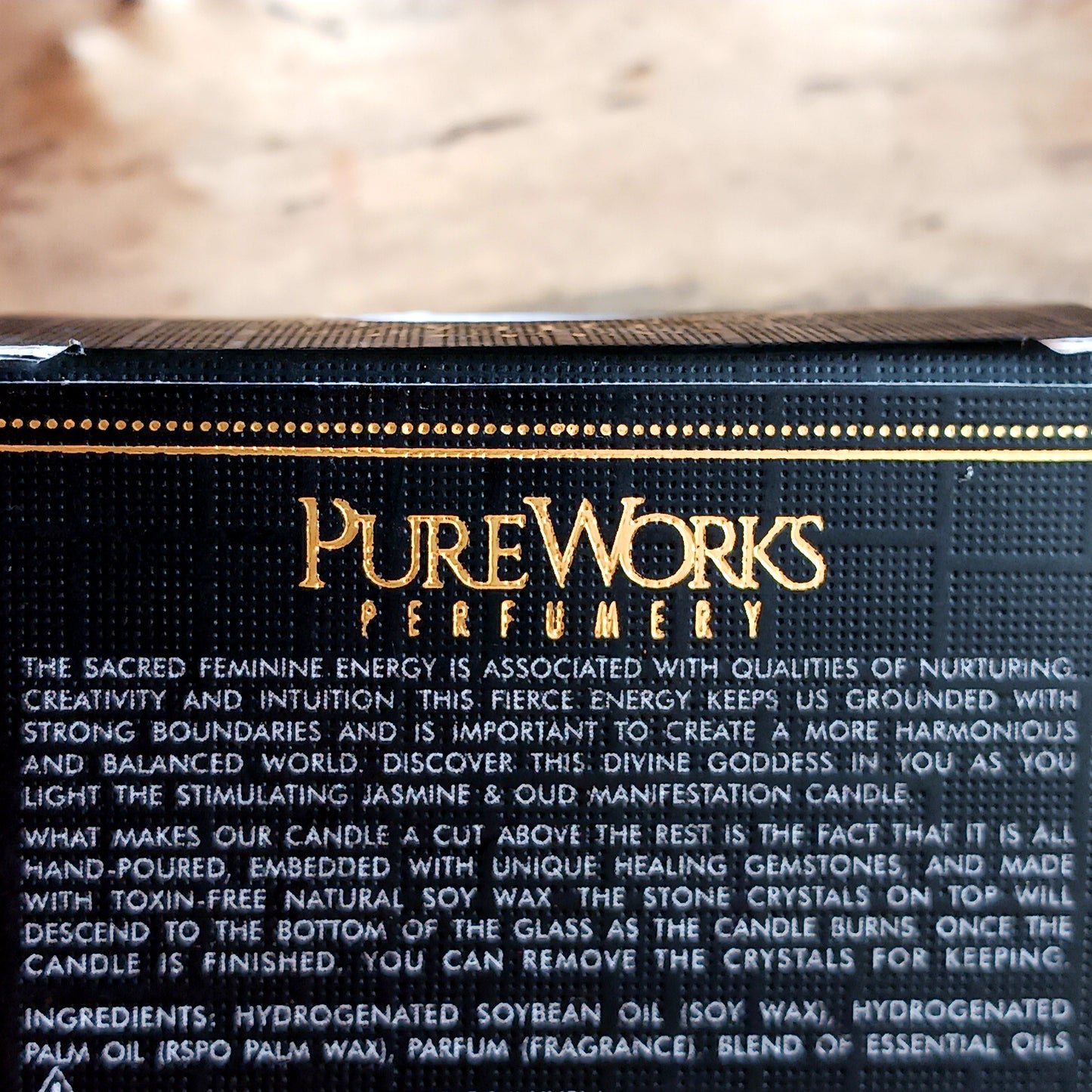 This lustrous manifestation candle in a coloured glass container, has been hand poured from toxin-free soy and blended with Jasmine and Oud essential oils and gemstones.
