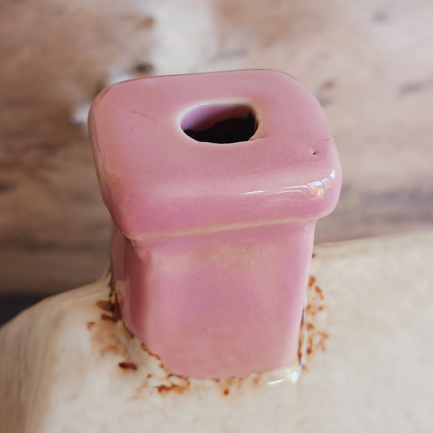 A comforting glow brews within the Coffee Pot Shop, where candlelight flickers like steam rising from a warm cup in a quiet enchanted village. This Shudehill Village Pottery tealight house is crafted from ceramic, casting a soft, golden light through its windows to create a scene of calm and gentle magic.