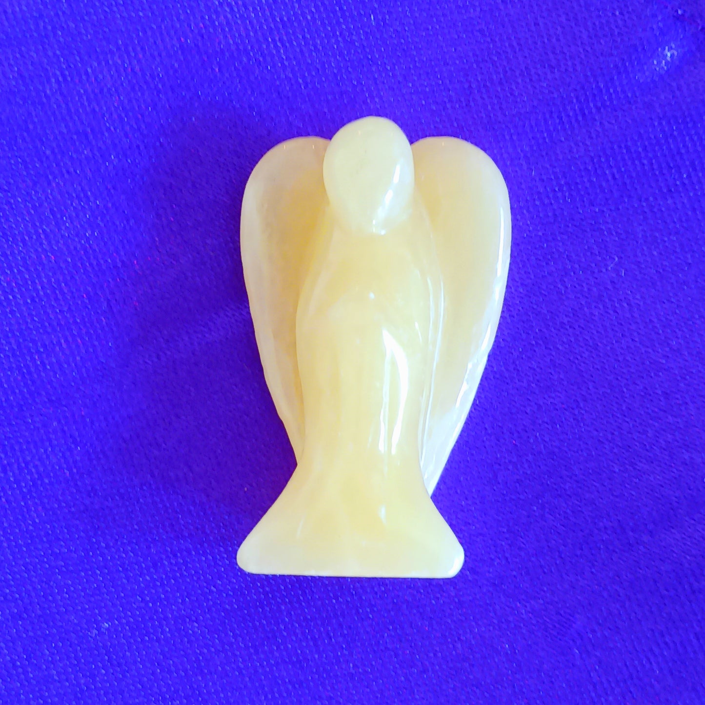 These little hand carved honey calcite crystal pocket angels are lovely as gifts. Each crystal angel is unique. They are designed to be held, placed in little corners or can be kept in your pocket.