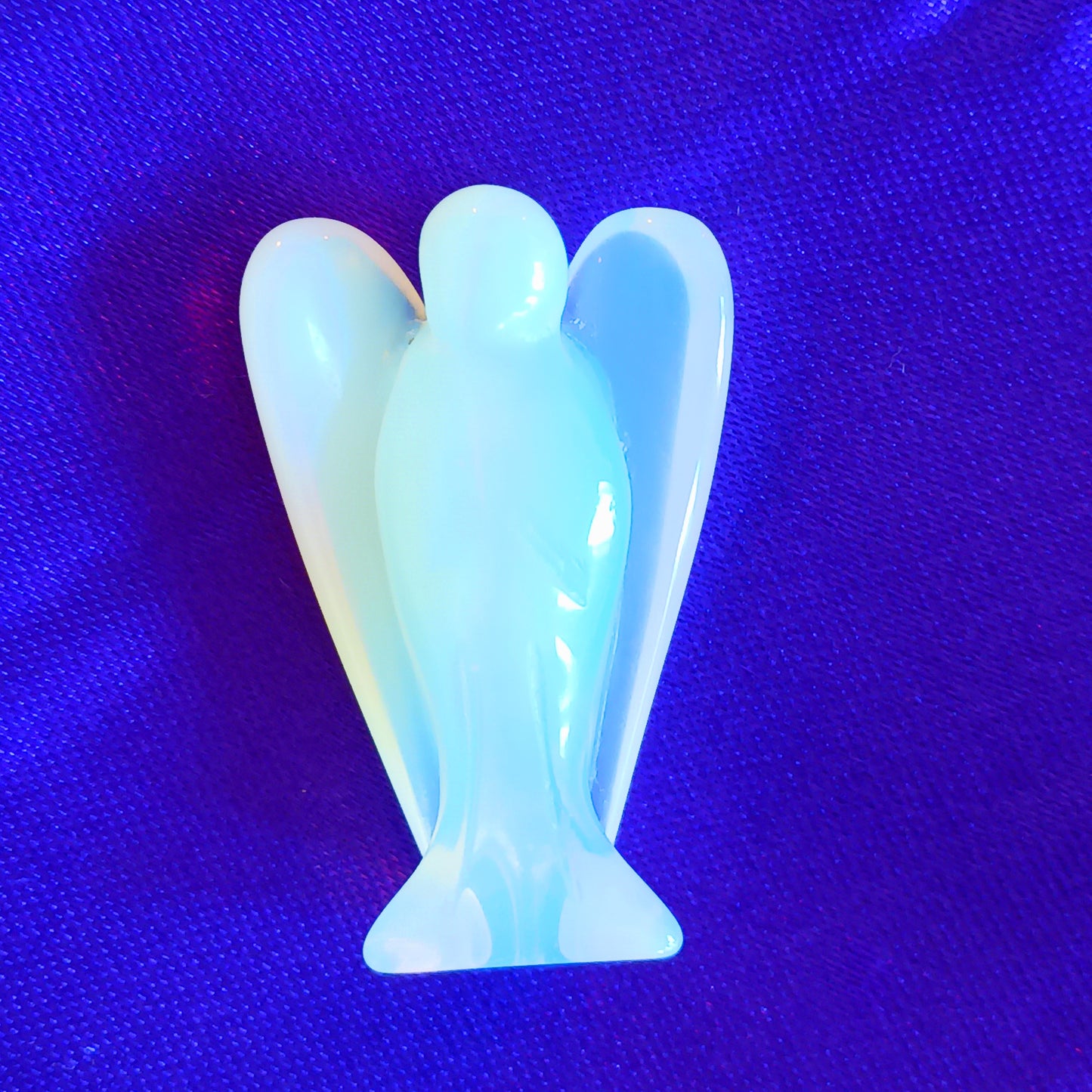 These little hand carved opalite crystal pocket angels are lovely as gifts. Each crystal angel is unique. They are designed to be held, placed in little corners or can be kept in your pocket.