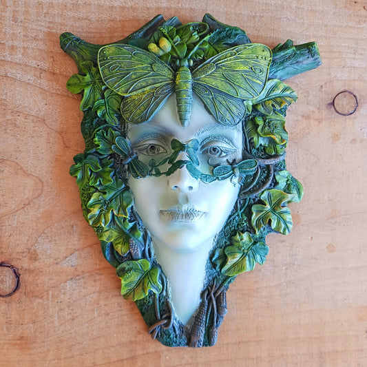 Bring the enchanting beauty of the forest into your home or garden with this stunning Green Goddess Resin Wall Plaque. Beautifully crafted with intricate leafy details, twisting branches and a striking butterfly crown, this decorative plaque captures the spirit of nature, growth and feminine energy.