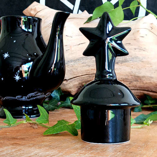 Add a touch of celestial magic to tea time with this striking black ceramic teapot, beautifully decorated with moon and star details and finished with a statement star-shaped lid.