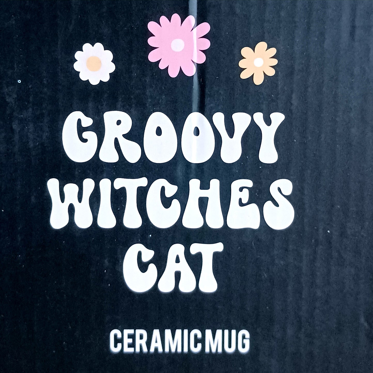 Add a spellbinding touch to your tea or coffee ritual with this groovy ceramic lidded mug, featuring an adorable cat wearing a whimsical witch hat adorned with a funky floral design. The matching ceramic lid helps keep your favourite brew warm, perfect for cosy autumn evenings or magical mornings.