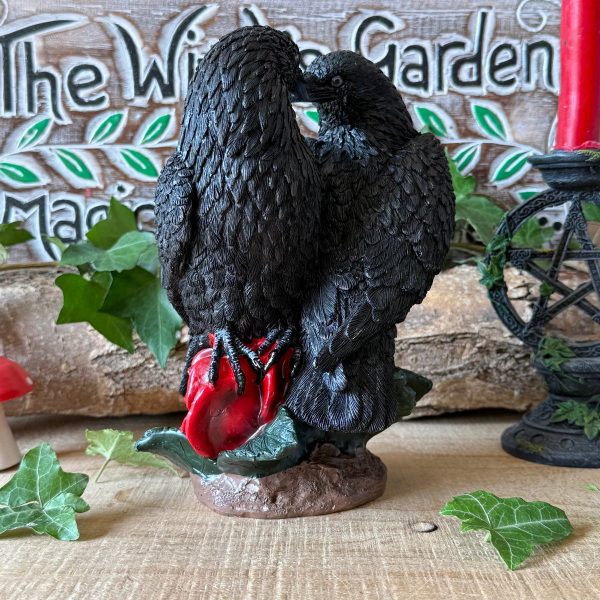 Nemesis Now Raven Romance figurine featuring two black ravens and red roses. Hand-painted gothic resin ornament for collectors, altars and raven lovers.