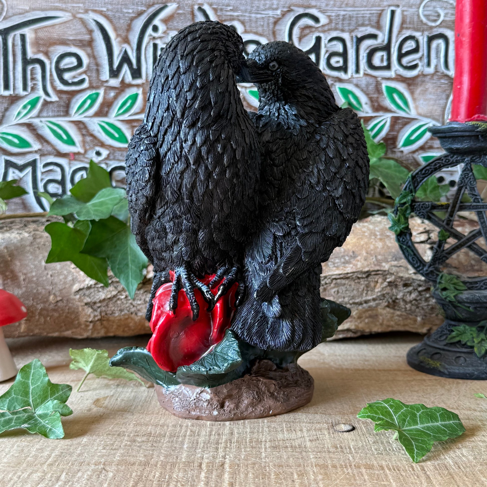 Nemesis Now Raven Romance figurine featuring two black ravens and red roses. Hand-painted gothic resin ornament for collectors, altars and raven lovers.