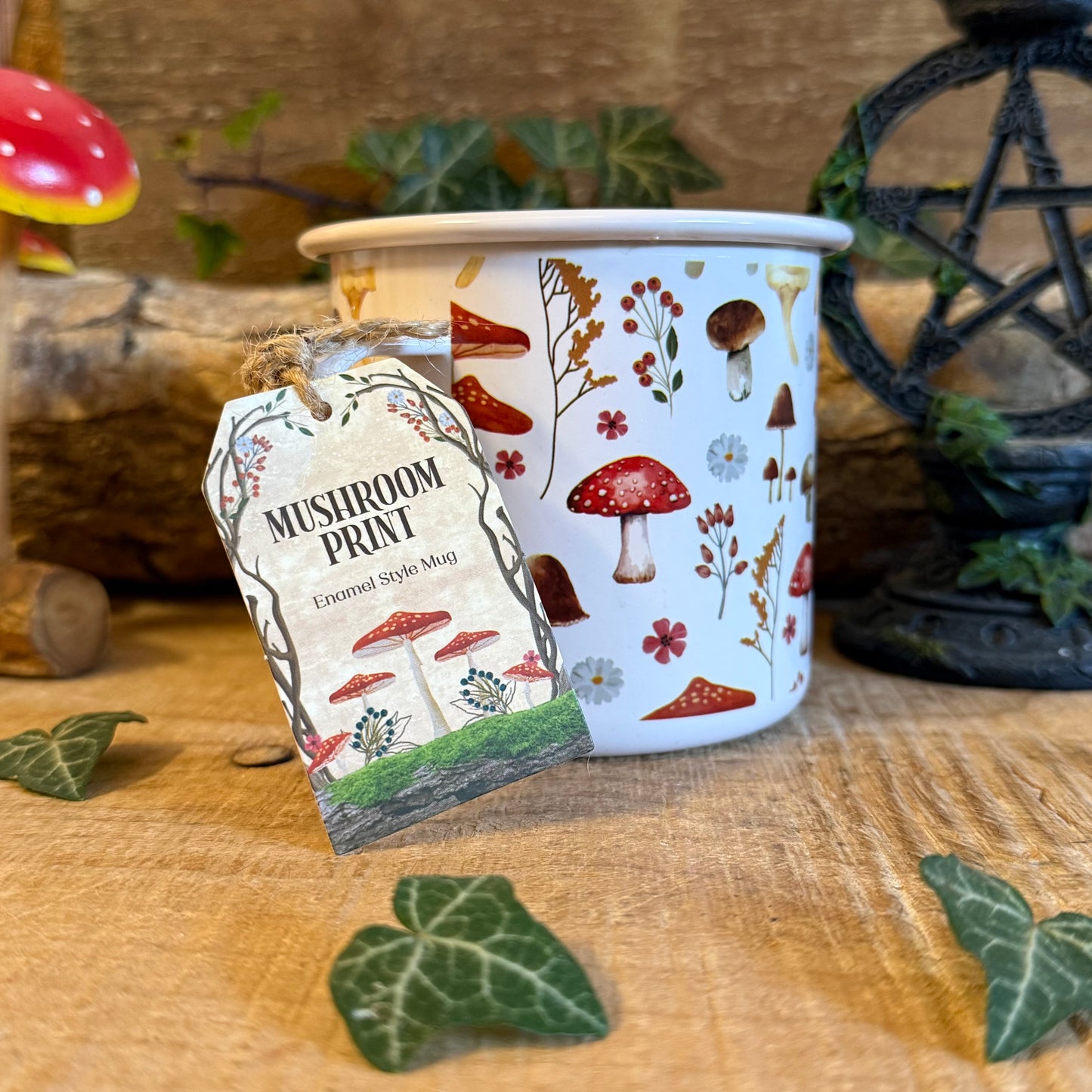 Enjoy tea in the All Over Mushroom Print Enamel Mug. Lightweight toadstool design, 500ml capacity, part of the Enchanted Forest collection.
