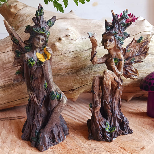 This enchanting set of two Woodland Guardian Spirits have been cast in the finest resin, and expertly hand painted.&nbsp; These lovely Woodland spirits have a wood-like appearance and sit serenely on a tree stump, sharing a caring embrace while protecting the creatures that inhabit the trees.  Hand painted in earthy green and browns, these figurines have intricate detail.&nbsp; A perfect gift for nature enthusiasts and collectors alike.