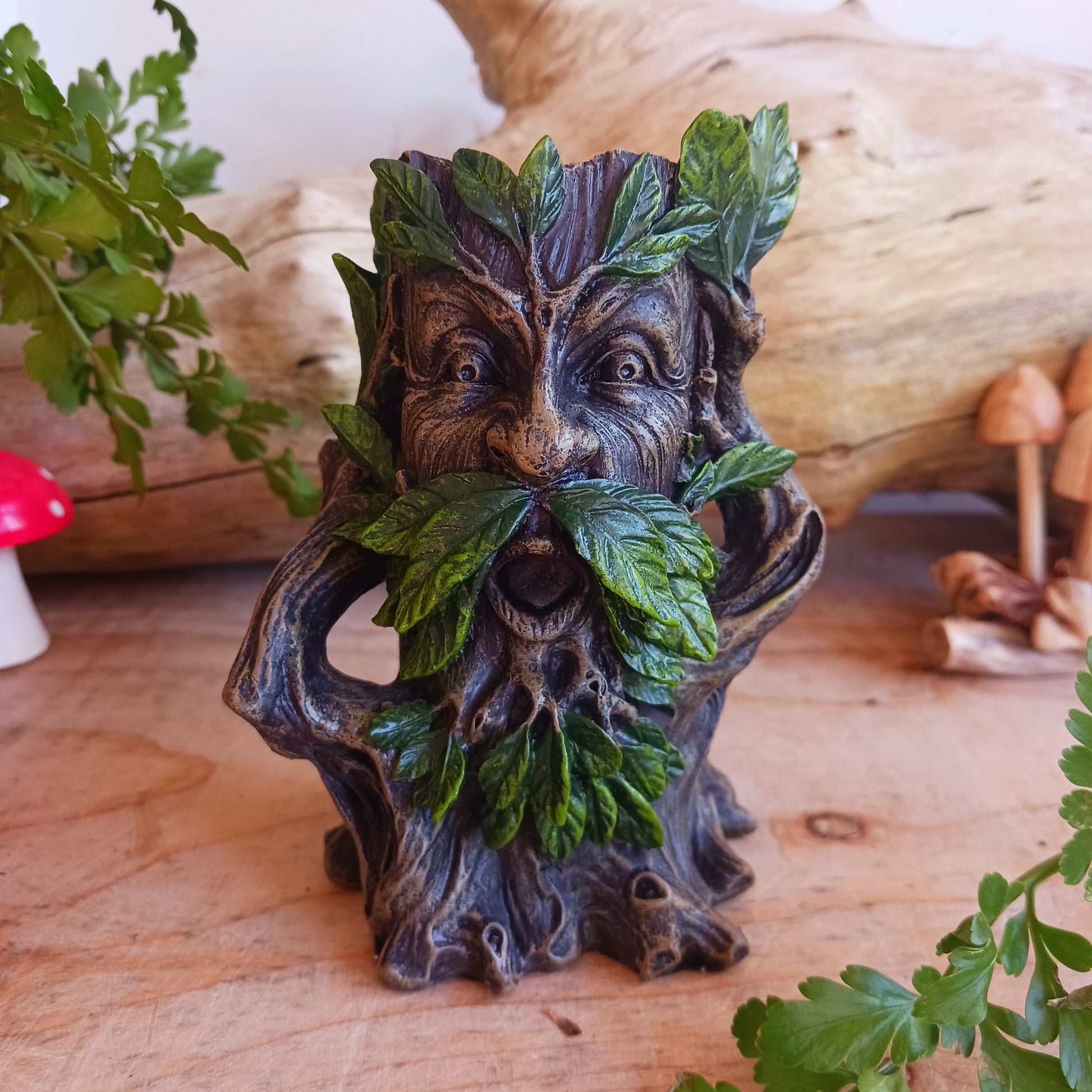 This delightful tealight candle holder is perfect for lighting up your home on dark nights, keeping you in touch with your natural spirit.&nbsp; It is cast in the guise of a Wildwood Tree Spirit, his mouth is open while his branch arms held up to the sides of his head.&nbsp; At the top there is a small space to put your tealight.  This Tree Spirit tealight holder has been cast in high quality resin and carefully hand painted.&nbsp; Perfect to gift for yourself or your nature loving friends and family.