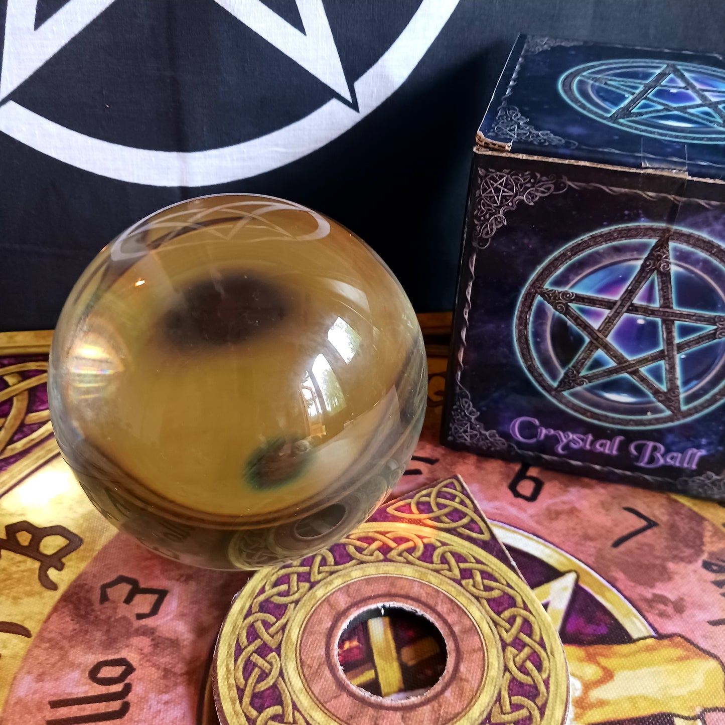 Step into the mystical world of divination with this Wiccan Witchcraft Divination Crystal Ball. This large flawless orbuculum measures 11cm and is flawlessly clear and spherical.  A must-have for both budding fortune tellers and seasoned practitioners of the mystical arts.