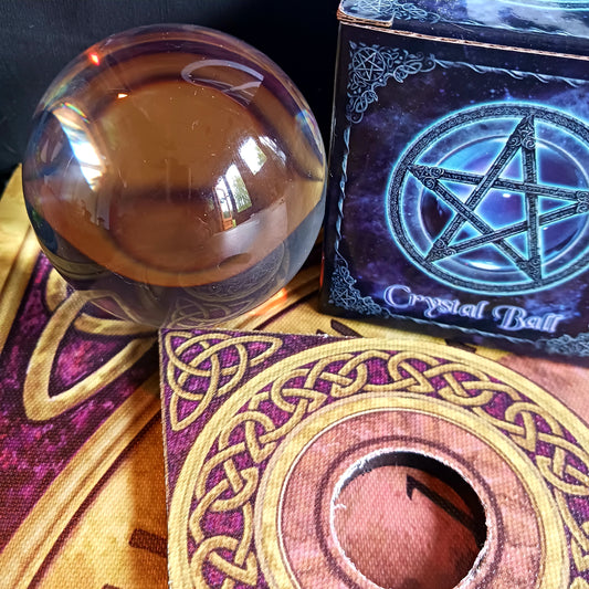 Step into the mystical world of divination with this Wiccan Witchcraft Divination Crystal Ball. This large flawless orbuculum measures 11cm and is flawlessly clear and spherical.  A must-have for both budding fortune tellers and seasoned practitioners of the mystical arts.