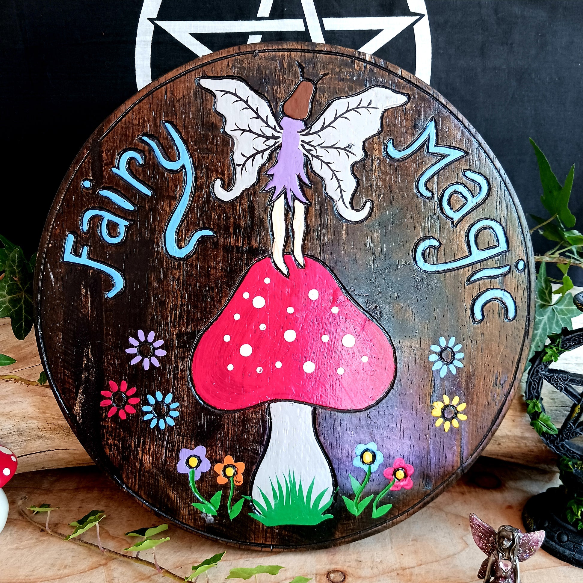 This magical wall plaque features a colourful hand-painted fairy and mushroom design and comes with a handy hook for easy hanging.