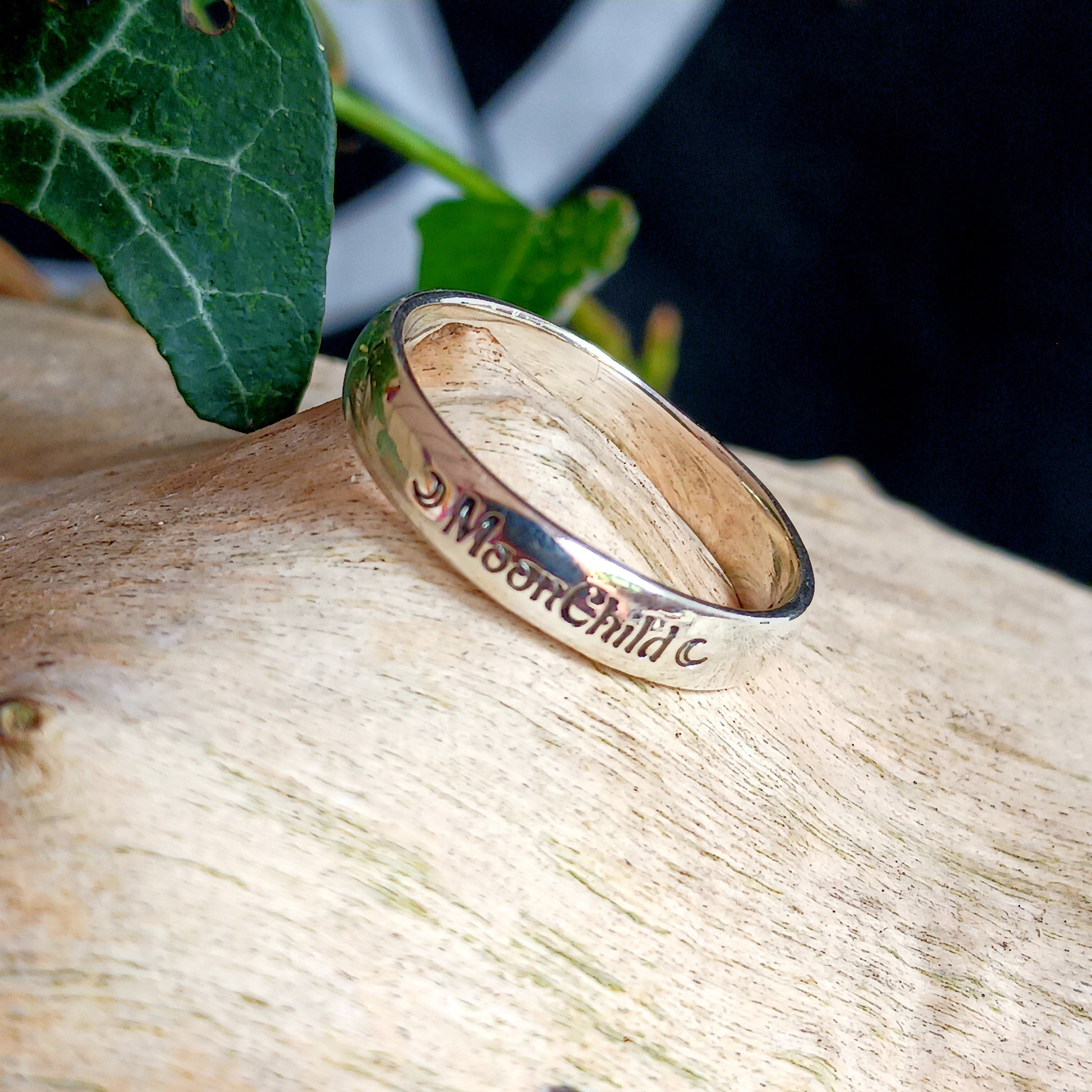 These elegant and sophisticated Sterling Silver Band rings have the words MoonChild engraved in Gothic lettering on the front.  Being a Moonchild can be a way of expressing a deep appreciation for the natural world, the cycles of life, and the mystical or spiritual aspects of the moon.  Made from Sterling Silver and available in three sizes (see below), these bands make a lovely gift for someone special.  Gifted in a black velvet pouch. &nbsp;  Sizes: UK Small, Medium, Large - U