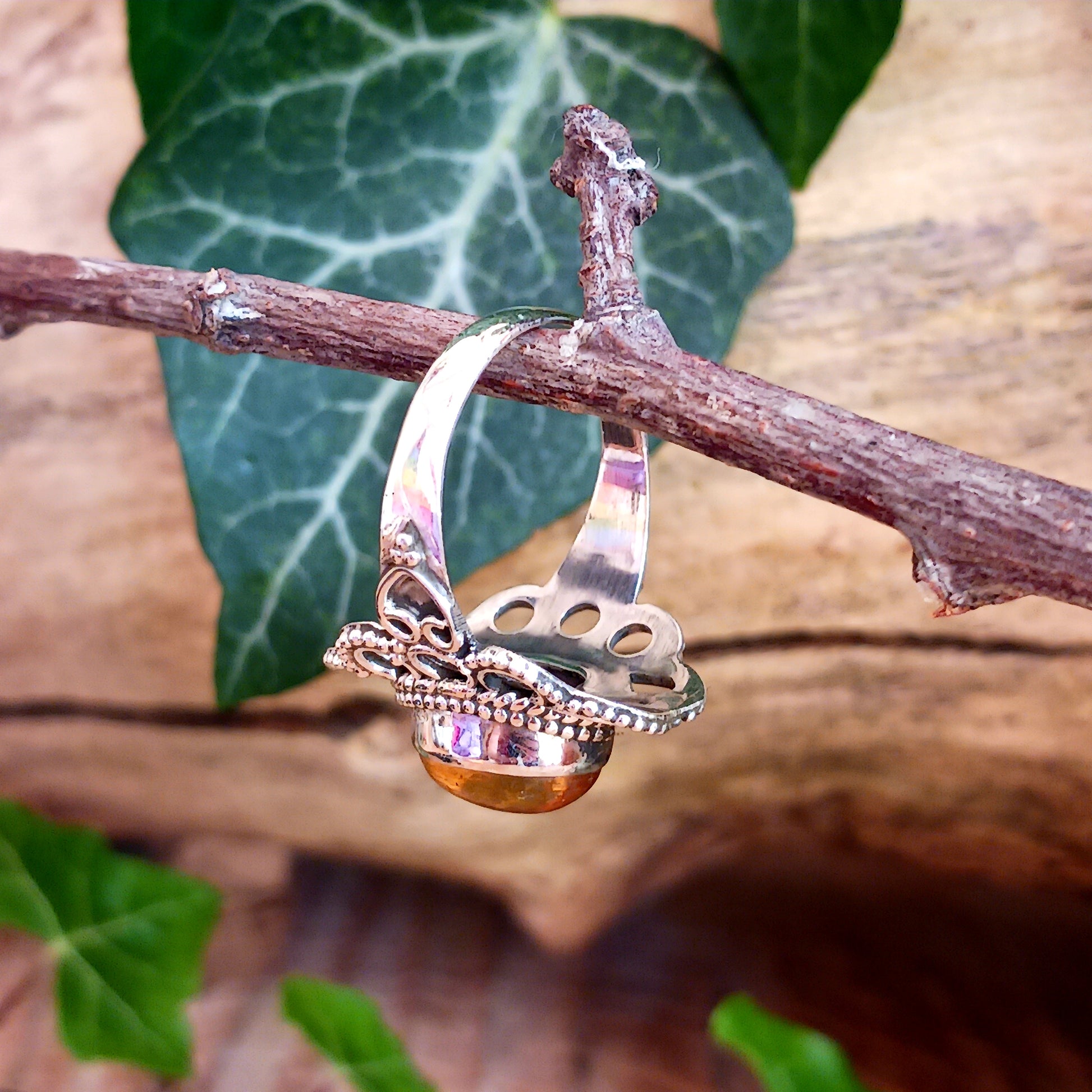 This beautiful ring features an intricate Boho Filigree coiling around the Stone held in the centre, which is an almond-shape Amber gemstone in a wonderful translucent Amber Colour.   The shank is slightly oxidized to show detail and looks lovely with the Amber brightness. A little bit of Gothic with a boho twist!