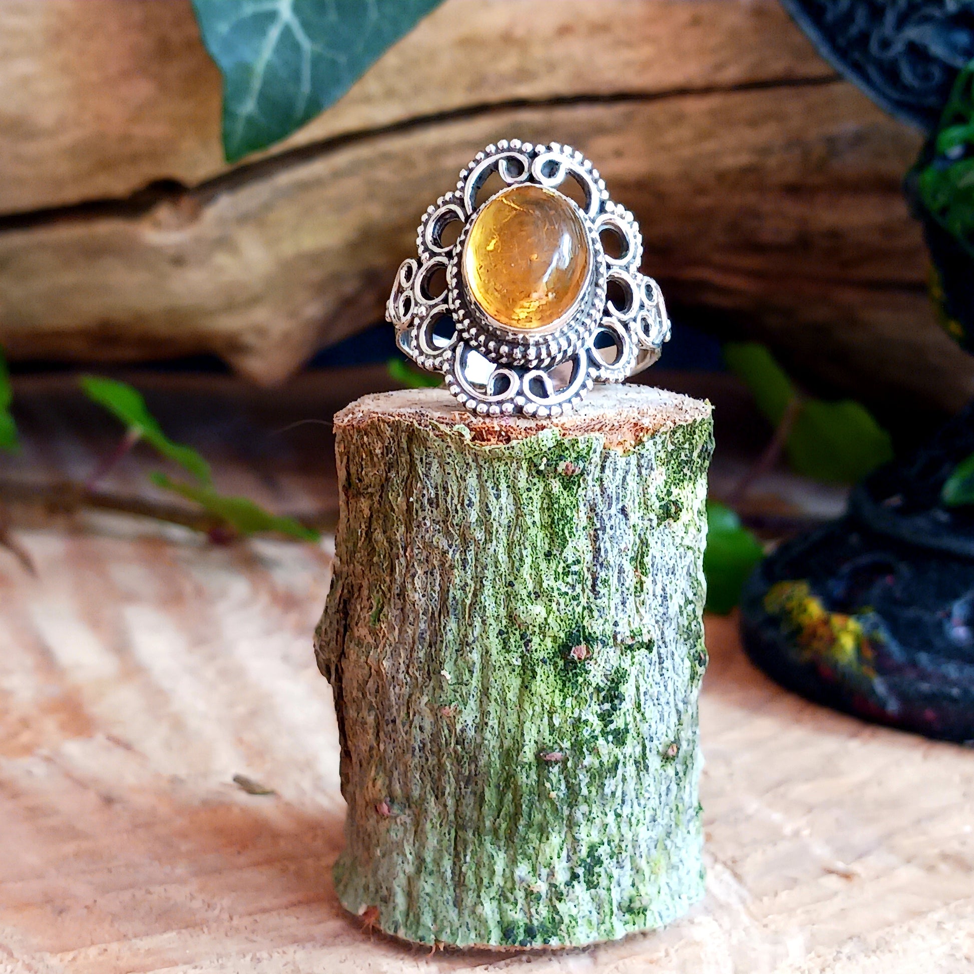 This beautiful ring features an intricate Boho Filigree coiling around the Stone held in the centre, which is an almond-shape Amber gemstone in a wonderful translucent Amber Colour.   The shank is slightly oxidized to show detail and looks lovely with the Amber brightness. A little bit of Gothic with a boho twist!