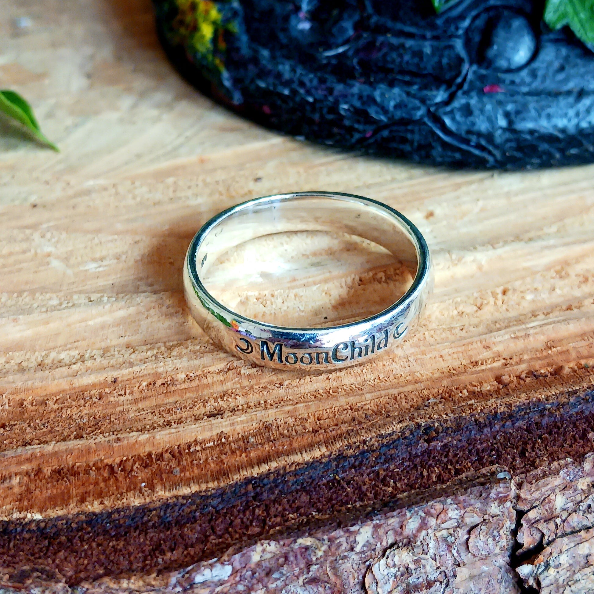 These elegant and sophisticated Sterling Silver Band rings have the words MoonChild engraved in Gothic lettering on the front.  Being a Moonchild can be a way of expressing a deep appreciation for the natural world, the cycles of life, and the mystical or spiritual aspects of the moon.  Made from Sterling Silver and available in three sizes (see below), these bands make a lovely gift for someone special.  Gifted in a black velvet pouch. &nbsp;  Sizes: UK Small, Medium, Large - U