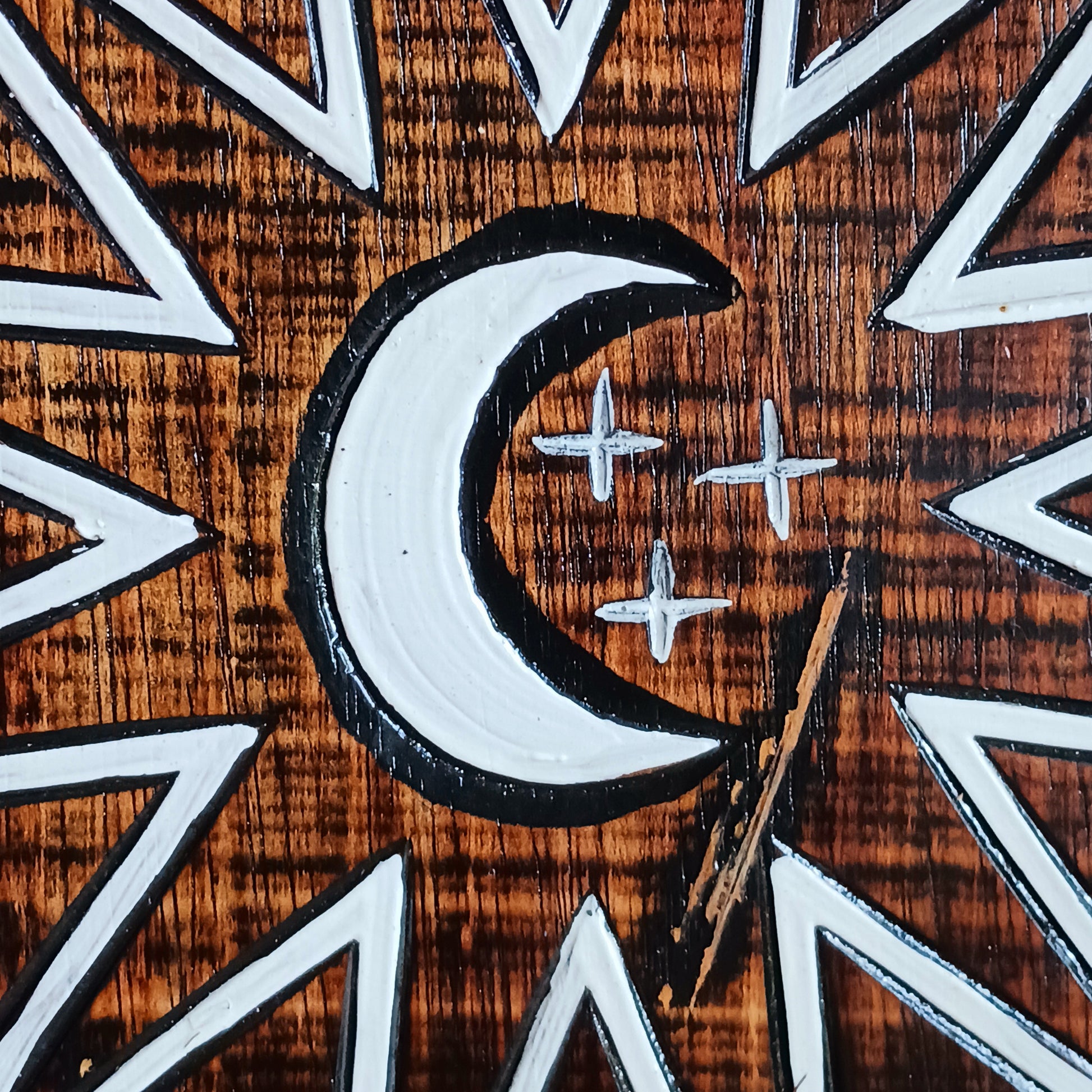 Hand carved and hand painted, this wooden wall plaque features a crescent moon and zodiac symbols design. This plaque comes complete with handy hanging hook.