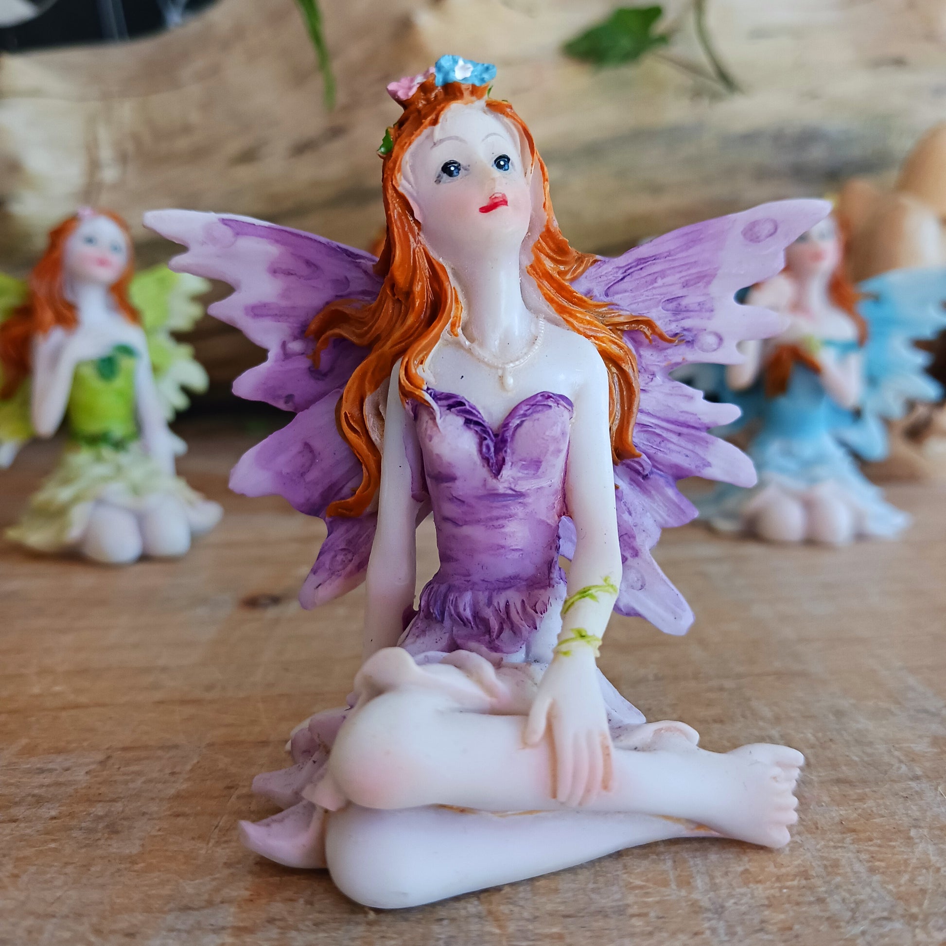 Kneeling on the ground, each of these adorable Fairies features a different colour and pose. They each have the sweetest faces and long wavy auburn hair.