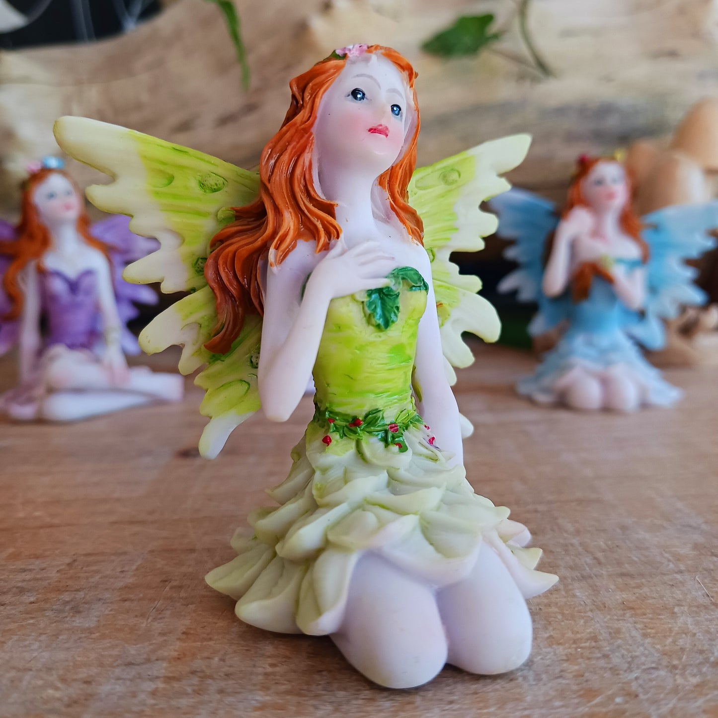 Kneeling on the ground, each of these adorable Fairies features a different colour and pose. They each have the sweetest faces and long wavy auburn hair.