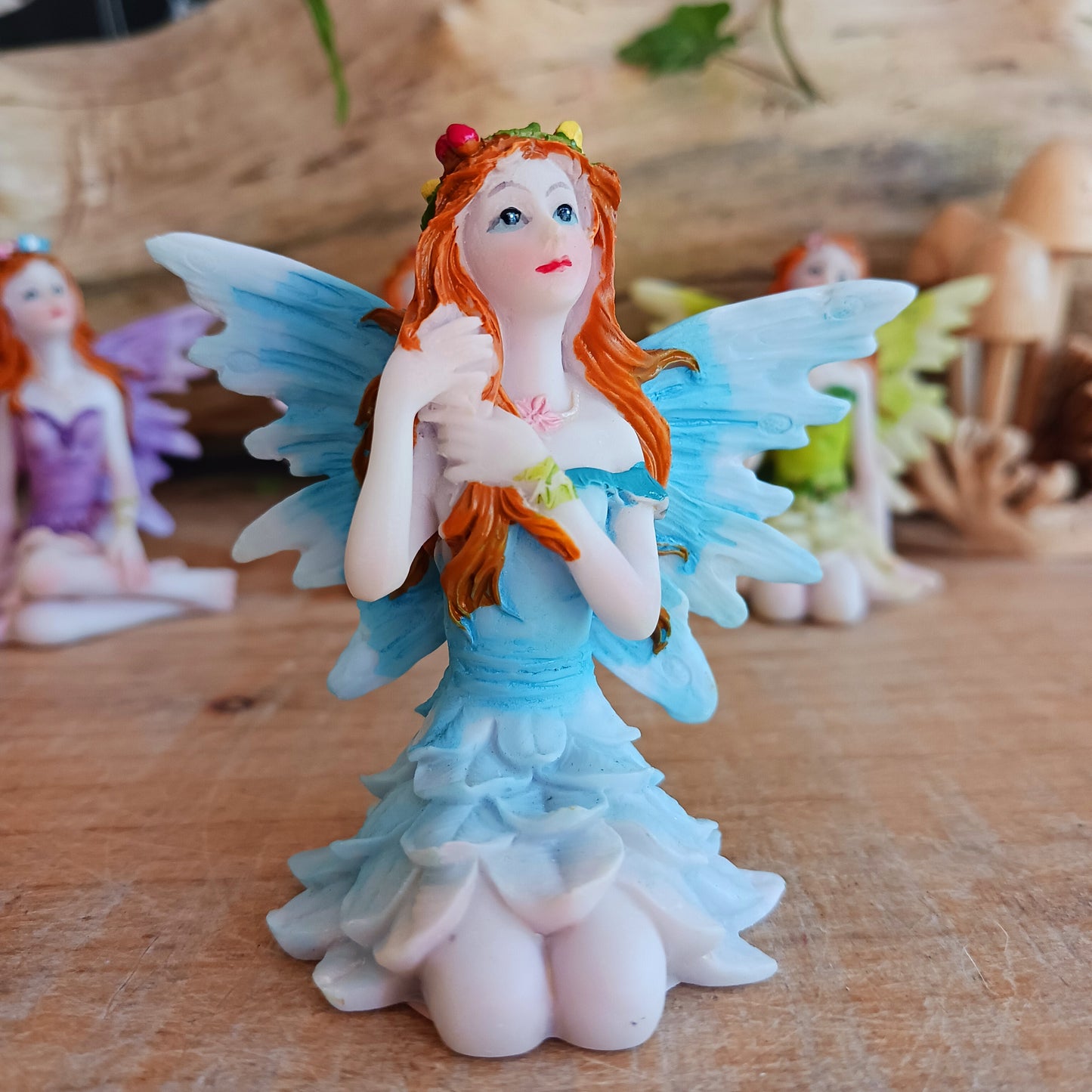 Kneeling on the ground, each of these adorable Fairies features a different colour and pose. They each have the sweetest faces and long wavy auburn hair.