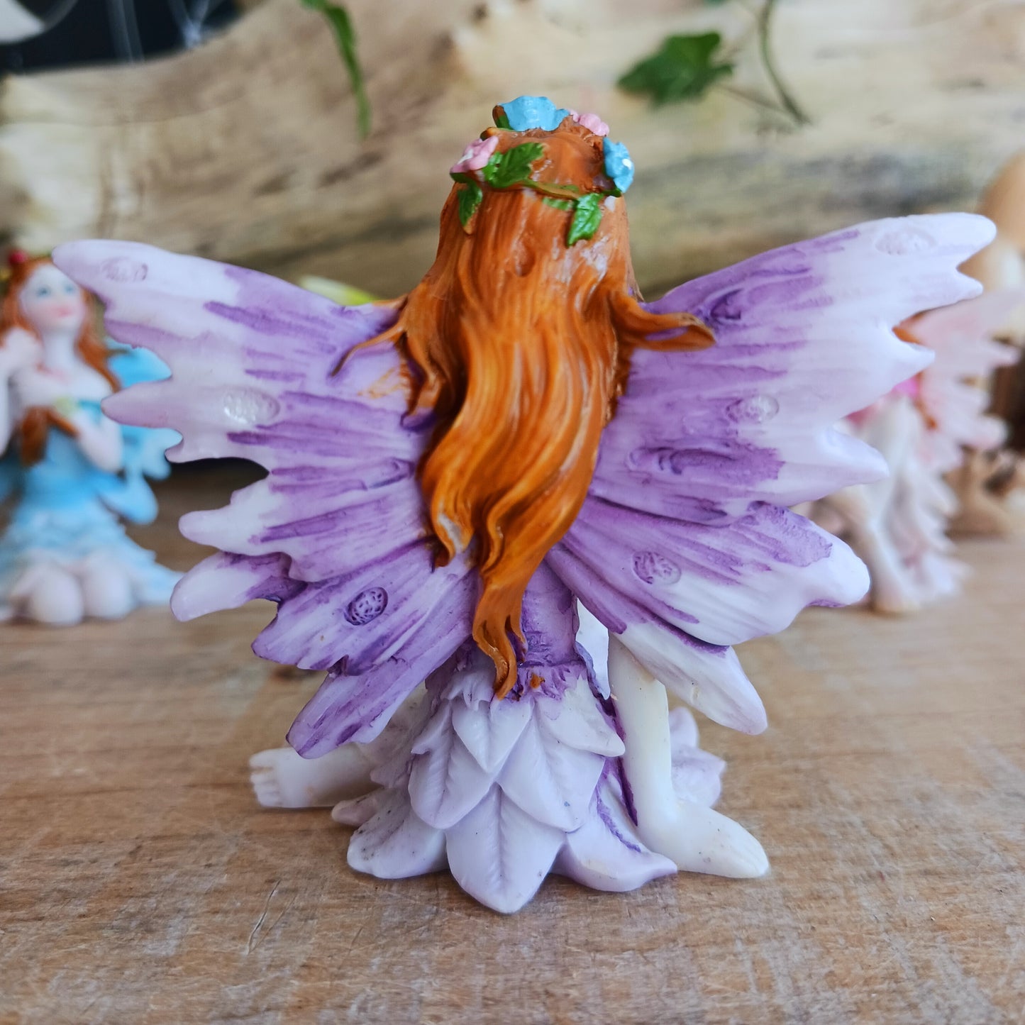 Kneeling on the ground, each of these adorable Fairies features a different colour and pose. They each have the sweetest faces and long wavy auburn hair.