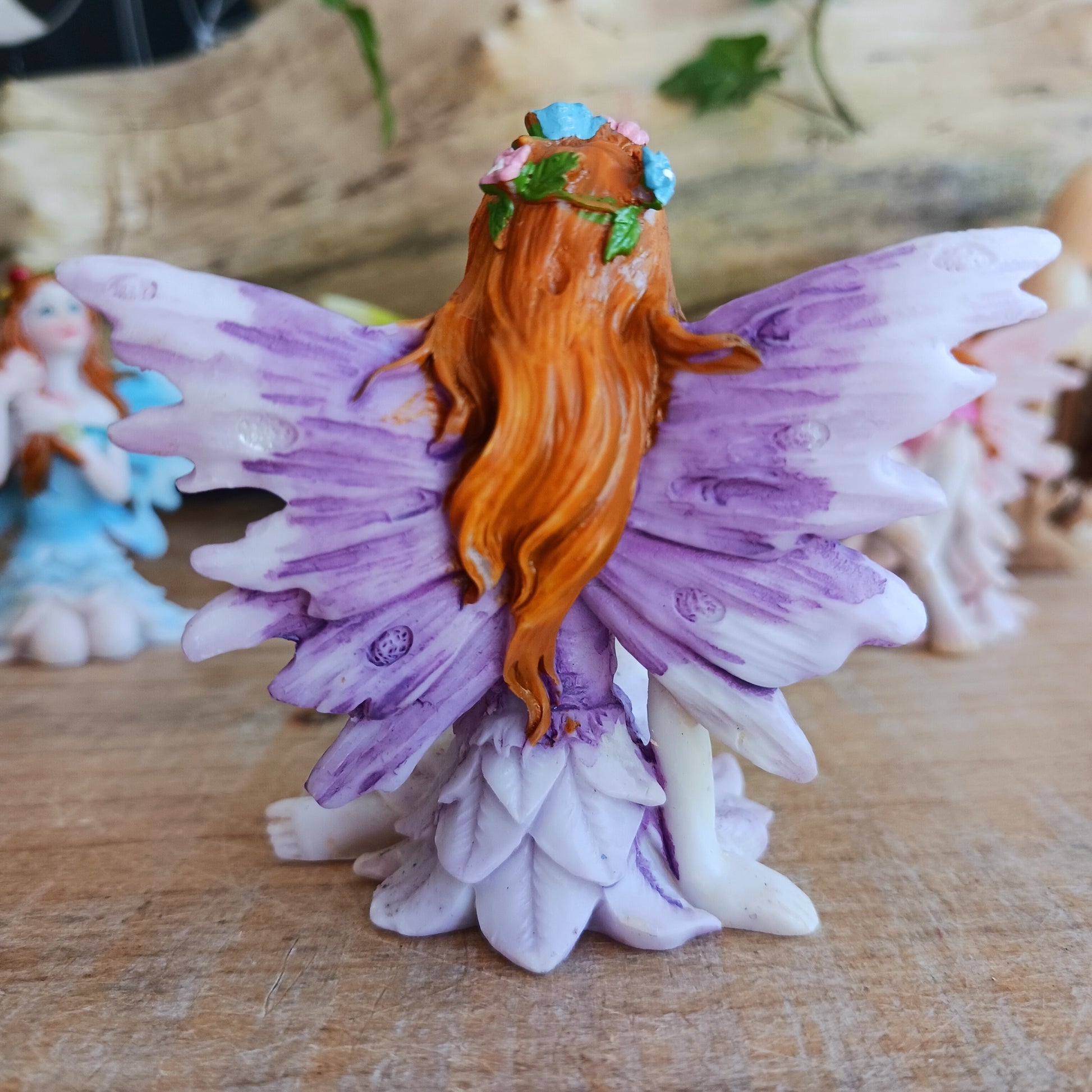 Kneeling on the ground, each of these adorable Fairies features a different colour and pose. They each have the sweetest faces and long wavy auburn hair.