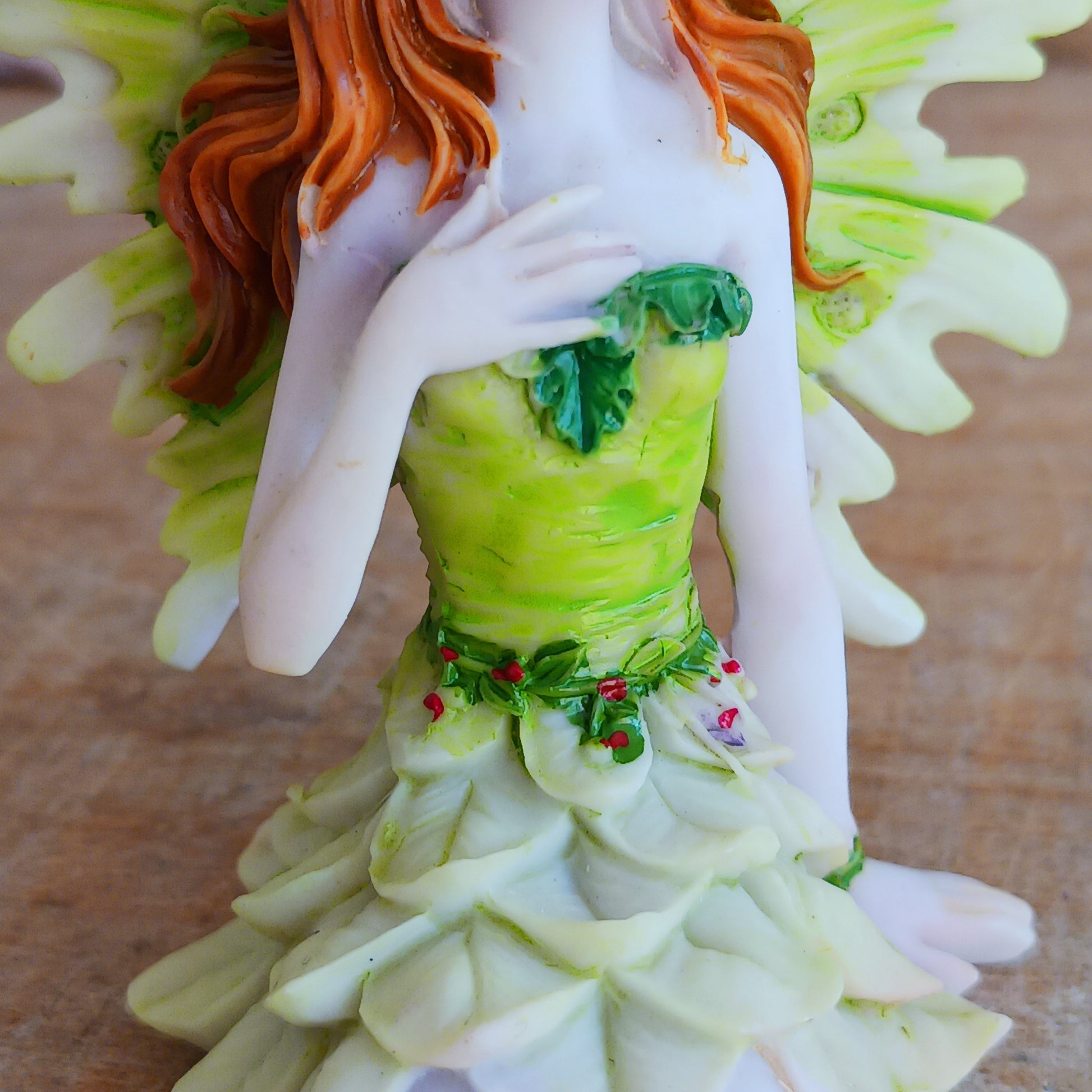 Kneeling on the ground, each of these adorable Fairies features a different colour and pose. They each have the sweetest faces and long wavy auburn hair.