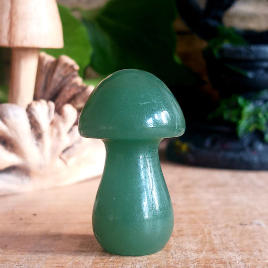 Harness the power of crystal healing with this Magical Crystal Mushroom crafted from polished aventurine. This beautiful stone promotes strength and bravery, making it a powerful tool for overcoming difficult tasks. Comes in a drawstring bag for easy storage with a matching informational insert card.