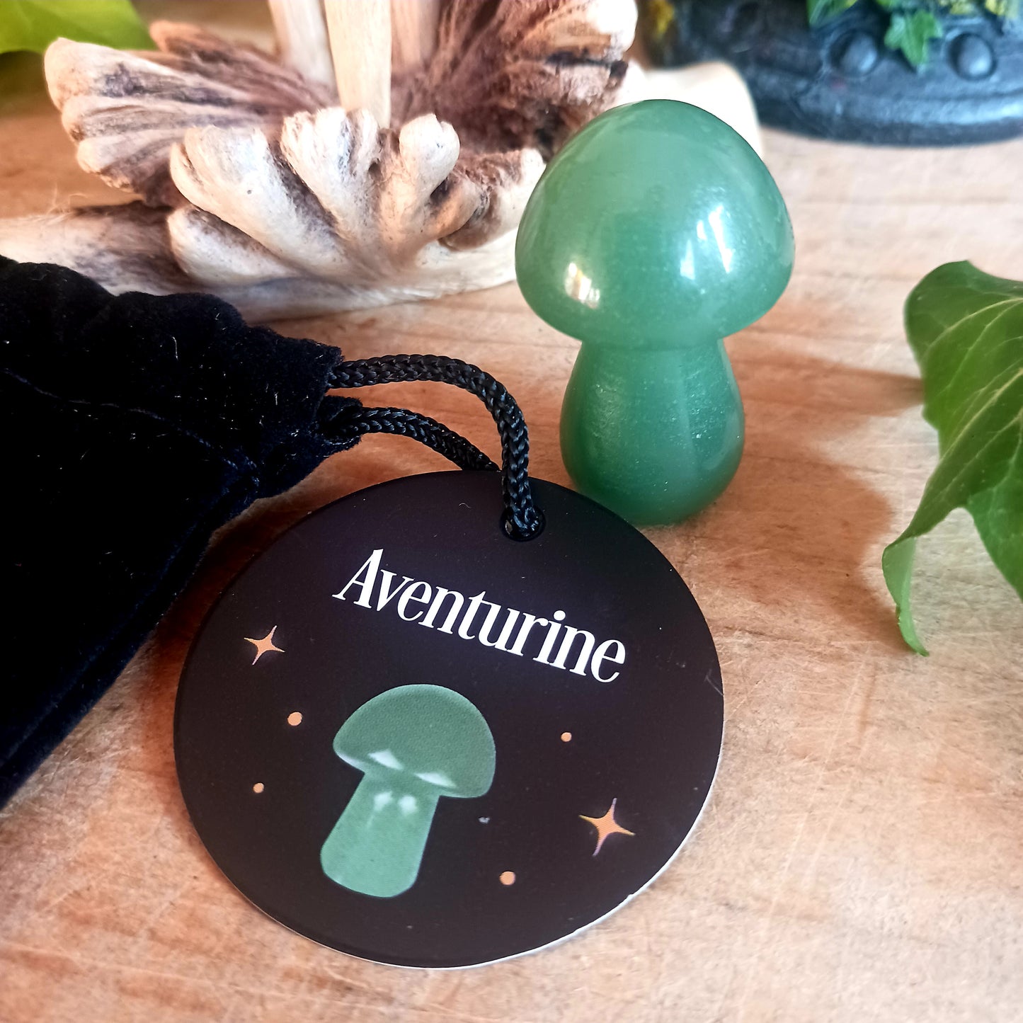 Harness the power of crystal healing with this Magical Crystal Mushroom crafted from polished aventurine. This beautiful stone promotes strength and bravery, making it a powerful tool for overcoming difficult tasks. Comes in a drawstring bag for easy storage with a matching informational insert card.