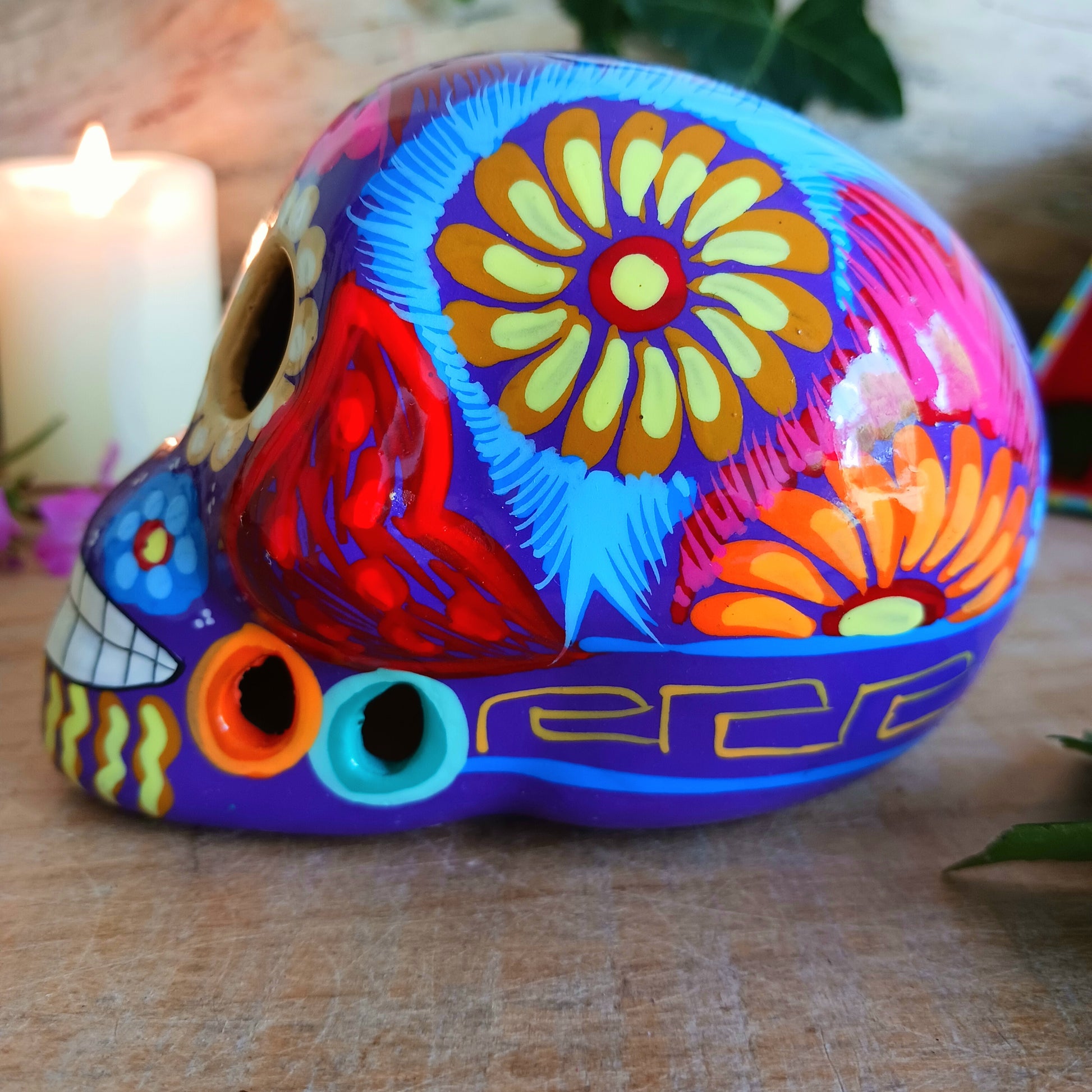 These fun ceramic sugar skull ornaments have been beautifully painted in bright colours and finished with a high shine glaze. They are a popular item during Día de Los Muertos or Day of the Dead festivities, held in Mexico every November to celebrate welcoming the souls of their deceased relatives back for a time of food, drink and celebration.