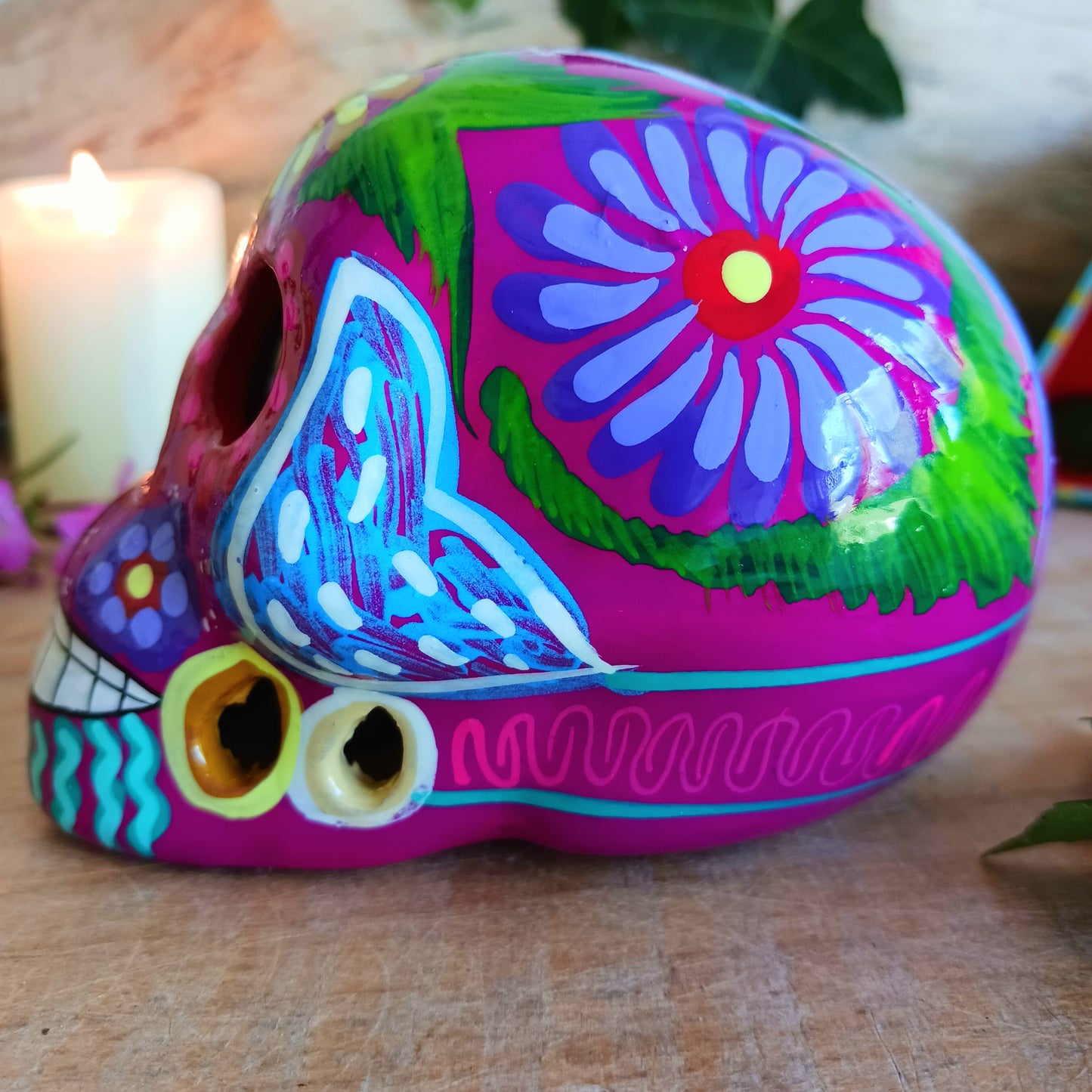 These fun ceramic sugar skull ornaments have been beautifully painted in bright colours and finished with a high shine glaze. They are a popular item during Día de Los Muertos or Day of the Dead festivities, held in Mexico every November to celebrate welcoming the souls of their deceased relatives back for a time of food, drink and celebration.