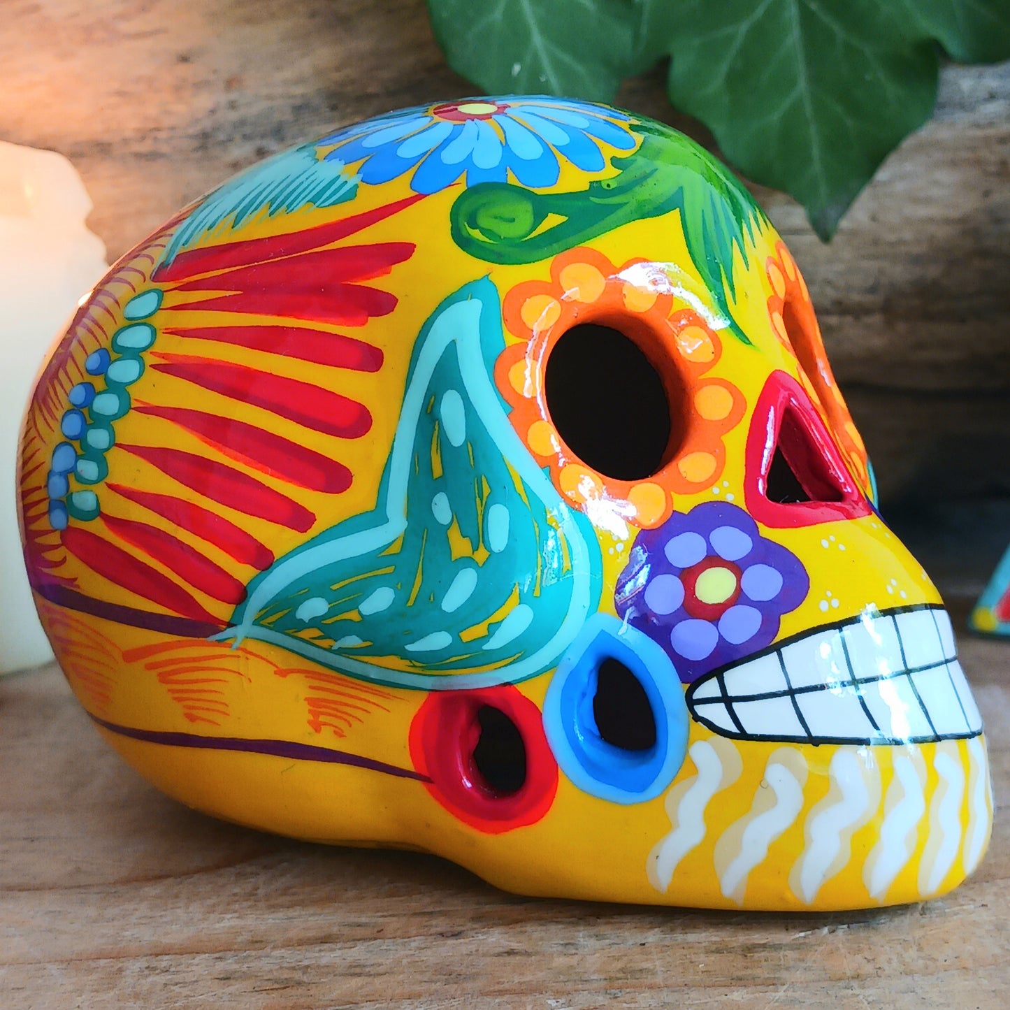 These fun ceramic sugar skull ornaments have been beautifully painted in bright colours and finished with a high shine glaze. They are a popular item during Día de Los Muertos or Day of the Dead festivities, held in Mexico every November to celebrate welcoming the souls of their deceased relatives back for a time of food, drink and celebration.