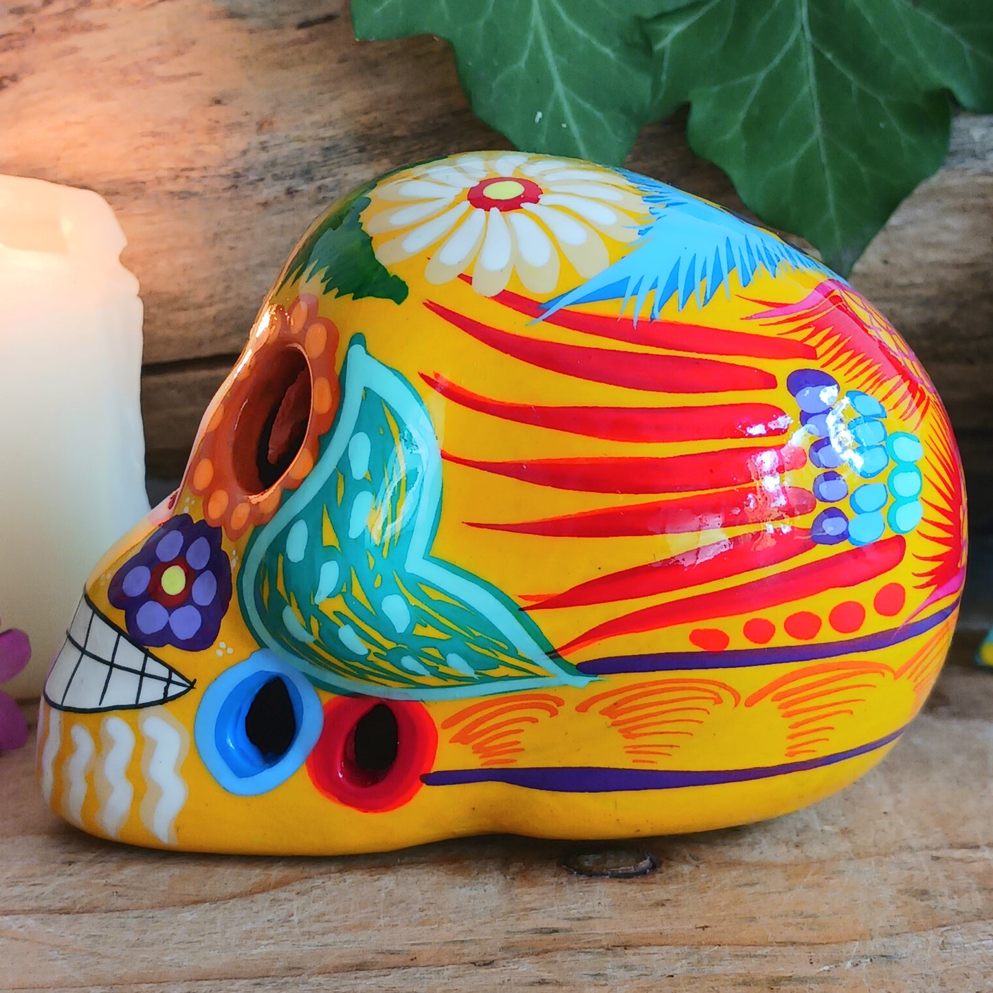 These fun ceramic sugar skull ornaments have been beautifully painted in bright colours and finished with a high shine glaze. They are a popular item during Día de Los Muertos or Day of the Dead festivities, held in Mexico every November to celebrate welcoming the souls of their deceased relatives back for a time of food, drink and celebration.