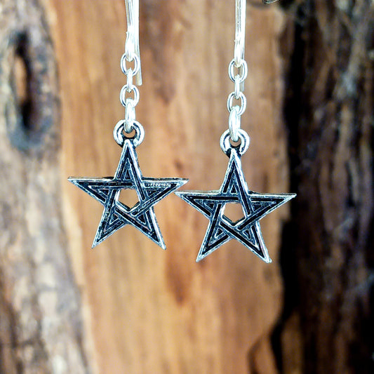 A pair of small, black enameled pewter pentagrams suspended a on fine chain and stainless steel ear-wires.