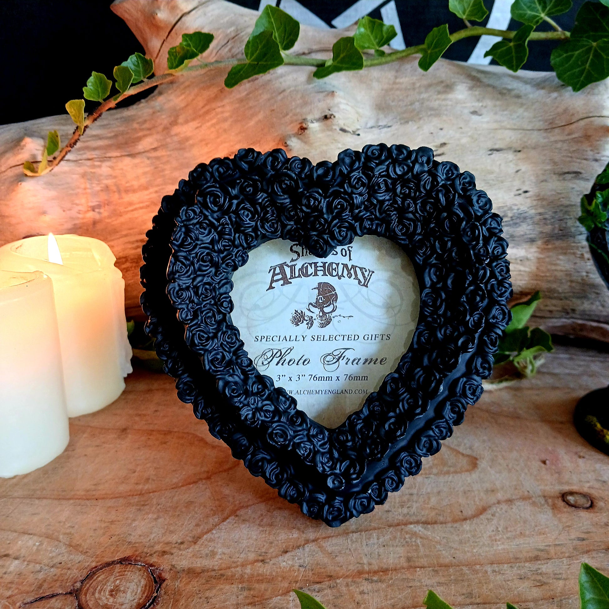 Finest quality black resin heart shape photo frame to fit photo size 3" x 3". Frame can be free standing or wall hung.