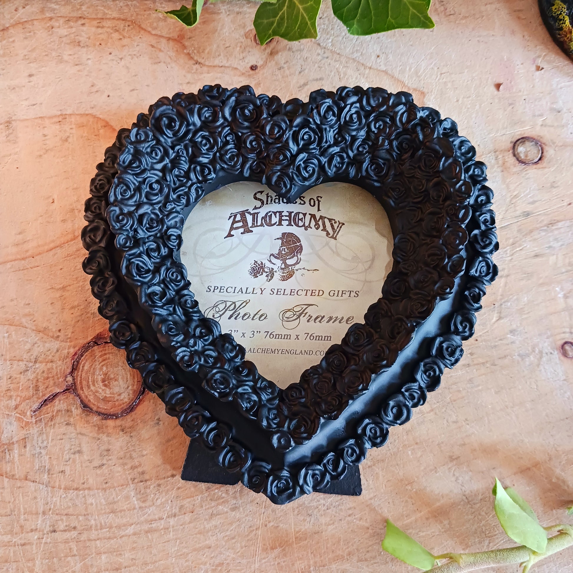 Finest quality black resin heart shape photo frame to fit photo size 3" x 3". Frame can be free standing or wall hung.