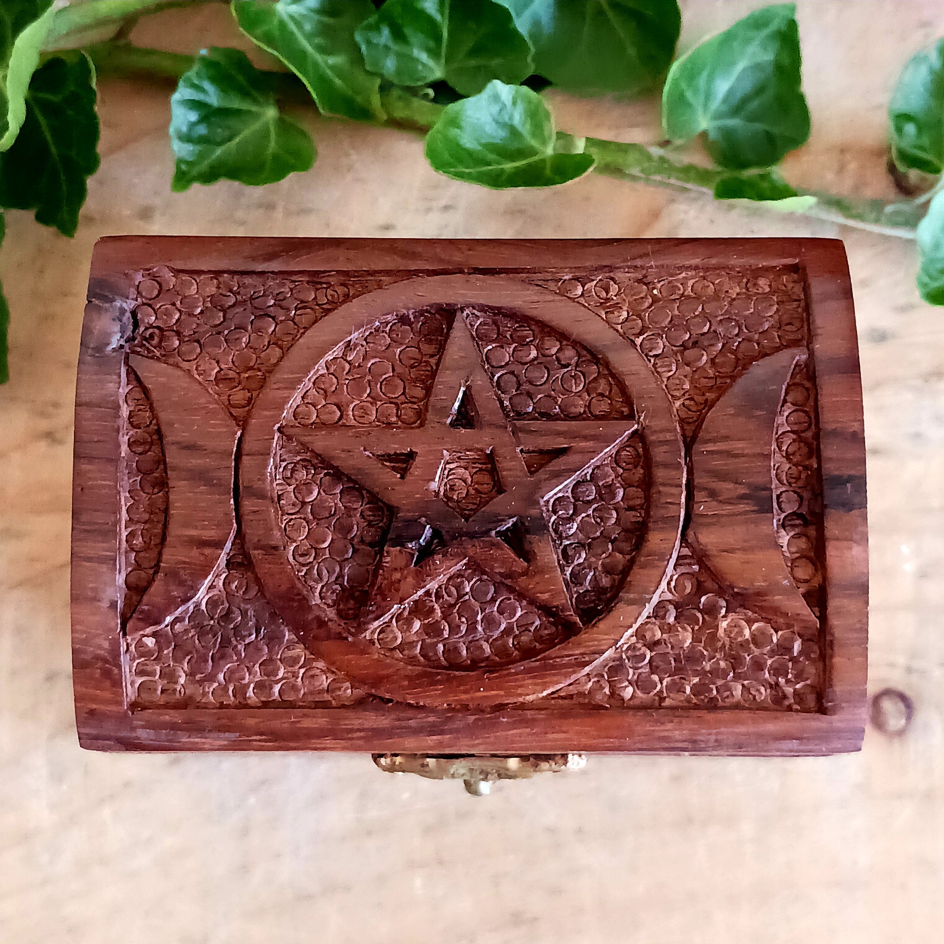 These cute little hand carved boxes have been decorated with an attractive triple goddess design and have been made from mango wood.