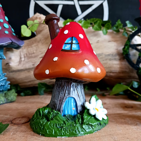 This red toadstool house design incense cone burner has wonderful detail. When the cone is burning, the smoke rises through the chimney of the item.