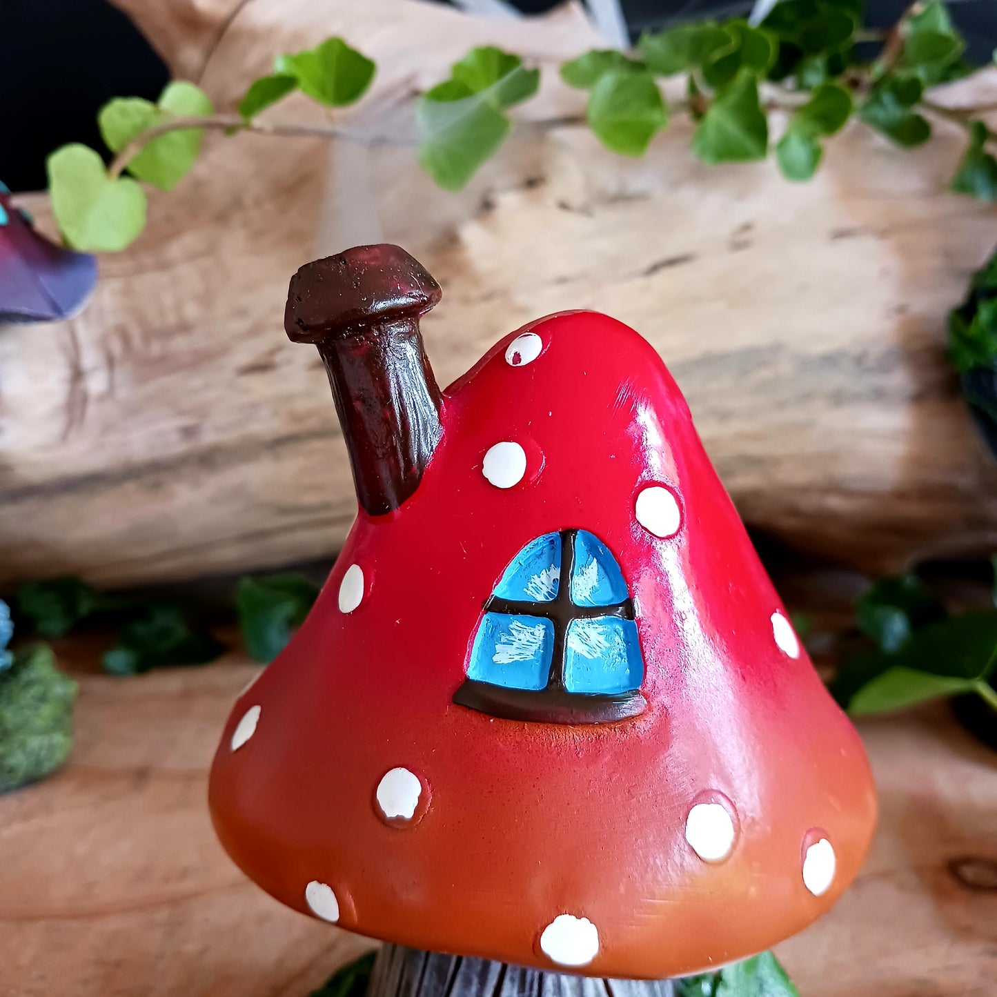 This red toadstool house design incense cone burner has wonderful detail. When the cone is burning, the smoke rises through the chimney of the item.