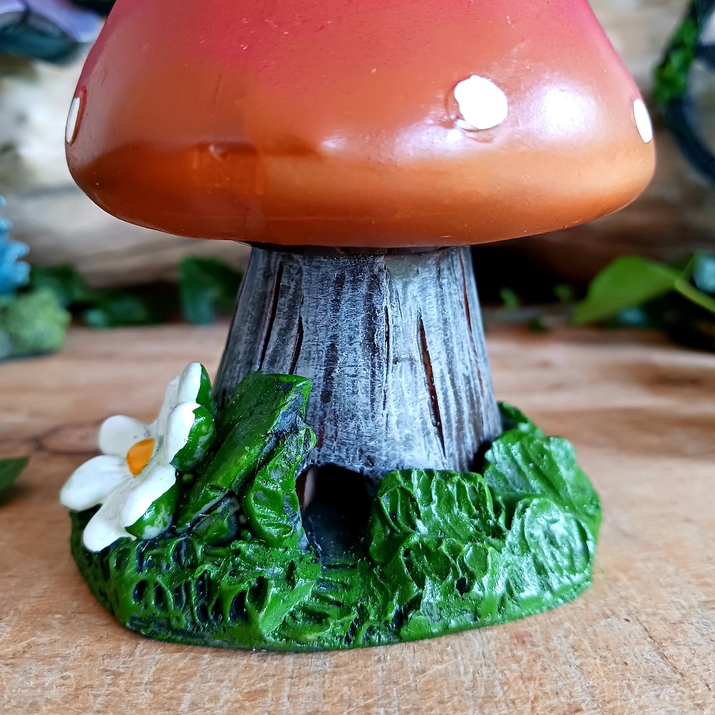 This red toadstool house design incense cone burner has wonderful detail. When the cone is burning, the smoke rises through the chimney of the item.