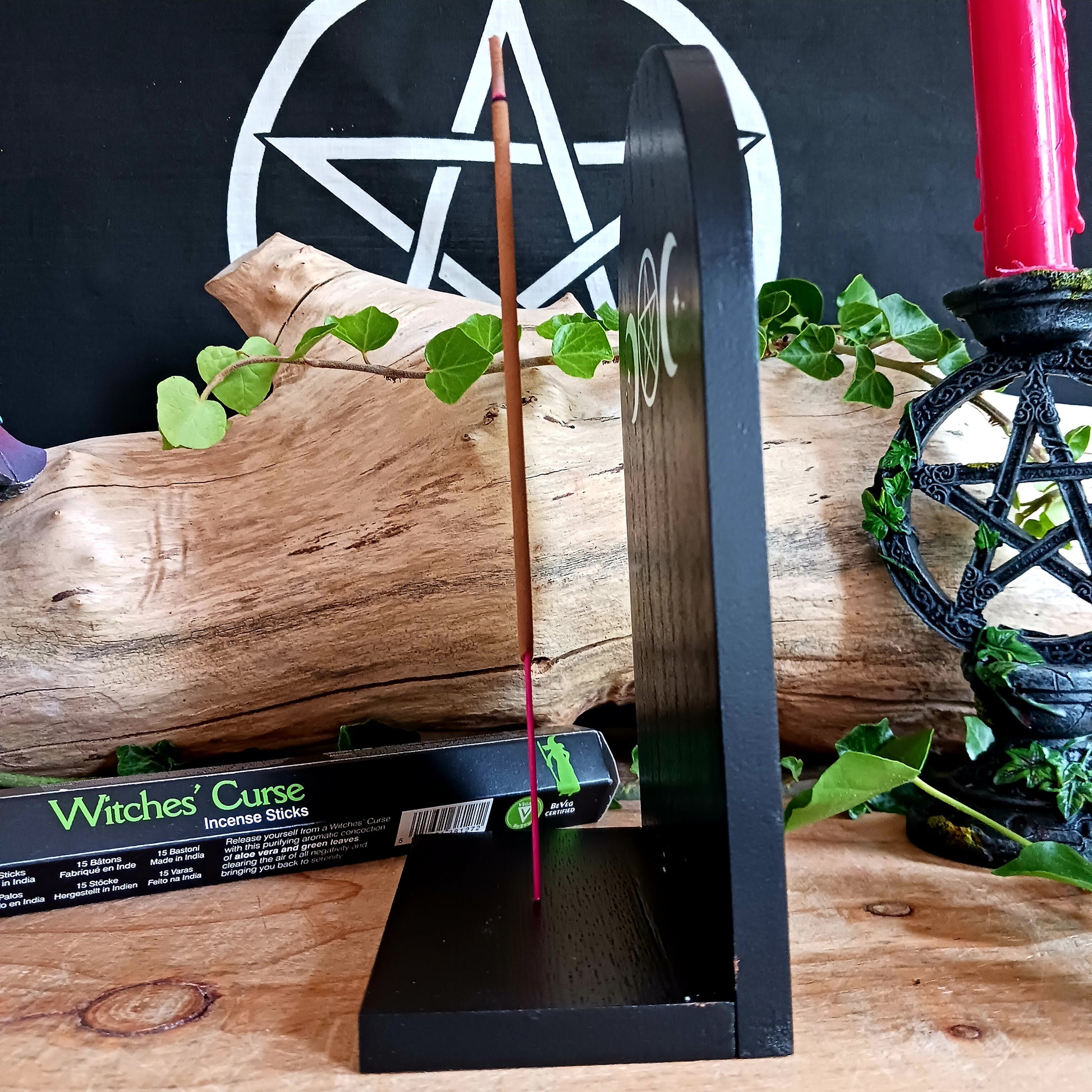 Add a touch of mystical ambiance and spiritual decor to your home with this black wooden incense shelf featuring a triple moon design, perfect for dispersing fragrance more freely.