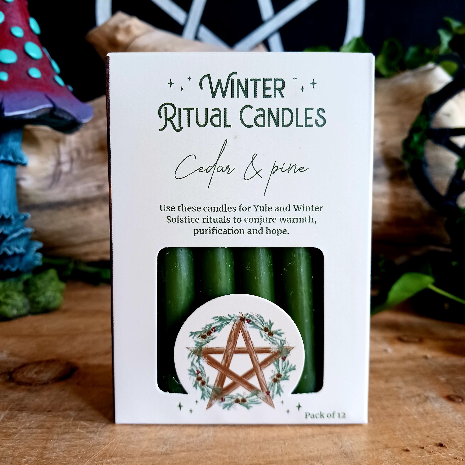 A pack of 12 Winter Ritual candles in a Cedar and Pine fragrance. Use these candles for Yule and Winter Solstice rituals, the ancient pagan holiday known for traditions and rituals that celebrate nature, rebirth, transformation and the oncoming season, to conjure warmth, purification and hope.