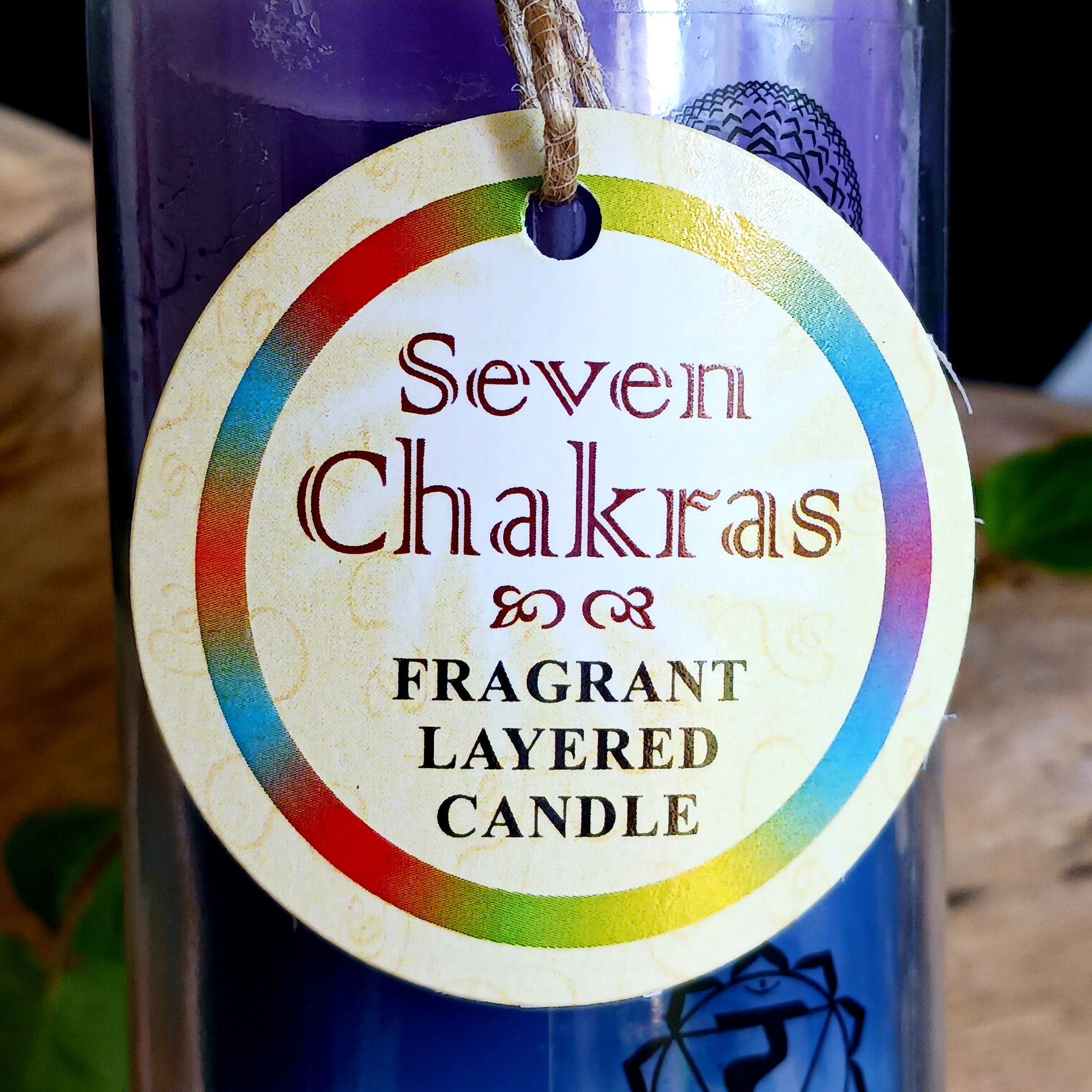 These tall tube candles have different coloured wax for each of the seven different chakras. The candle is presented in a tall glass holder with each chakra symbol over the relevant colour of wax.