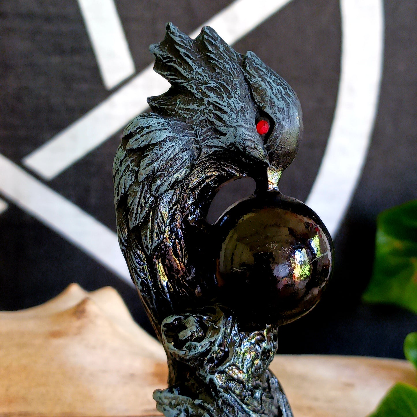 Immerse yourself in the world of witchcraft and wizardry with this impressive red-eyed dark grey raven wand, featuring a captivating black sphere – a true masterpiece that stands out in every magical collection.