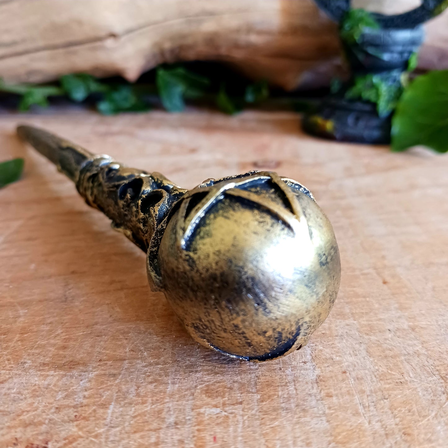 This enchanting wand features a bronze orb with pentagram symbol sitting atop an ornate and detailed wand stem. Elegant and appealing, this magic wand is a necessity for any witch or wizard's collection.